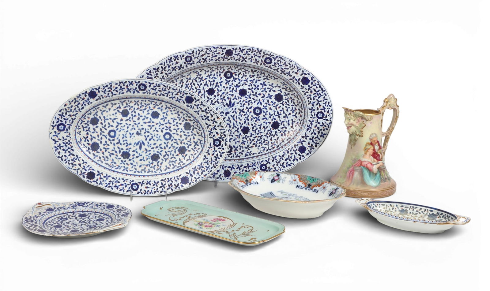 A group of seven European serving pieces: A group of seven European serving pieces Largest Platter: length 23 x width16 in. (58.4 x 40.6 cm.)