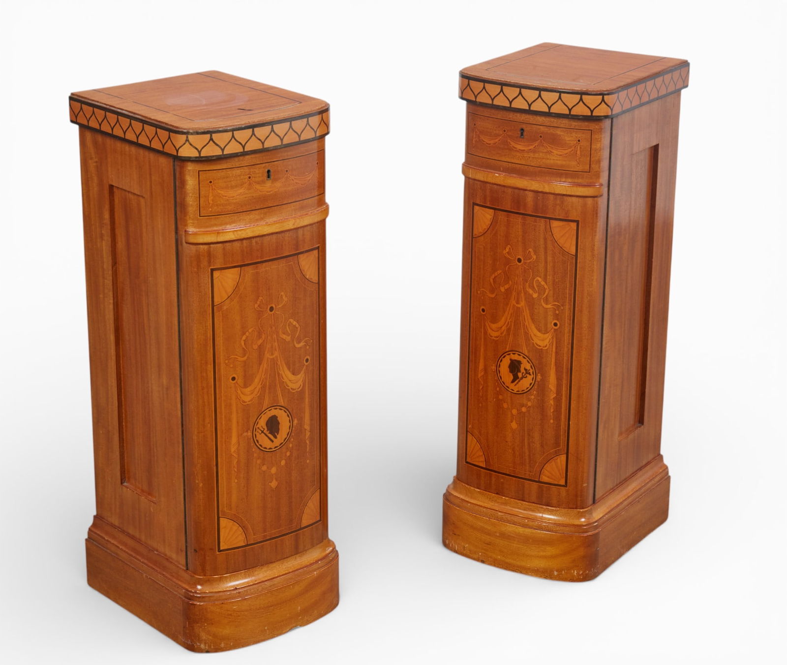A pair of marquetry satinwood cabinets: A pair of marquetry satinwood cabinets height 31 x width 10 1/2 x depth 11 1/2 in. (78.7 x 26.7 x 29.2 cm.)