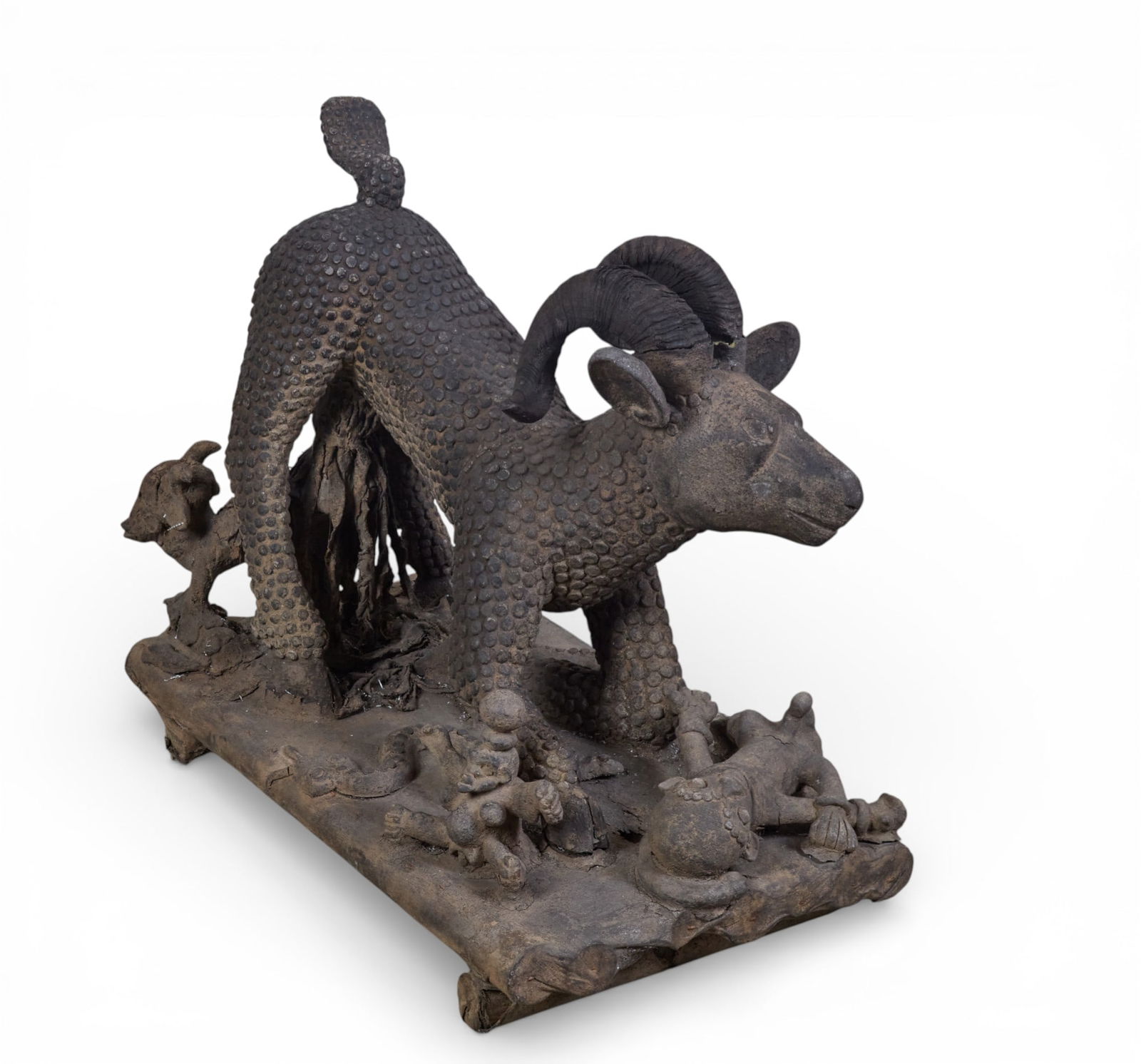 A carved stone figure: A carved stone figure height 29 x width 17 x length 31 in. (73.7 x 43.2 x 78.7 cm.)