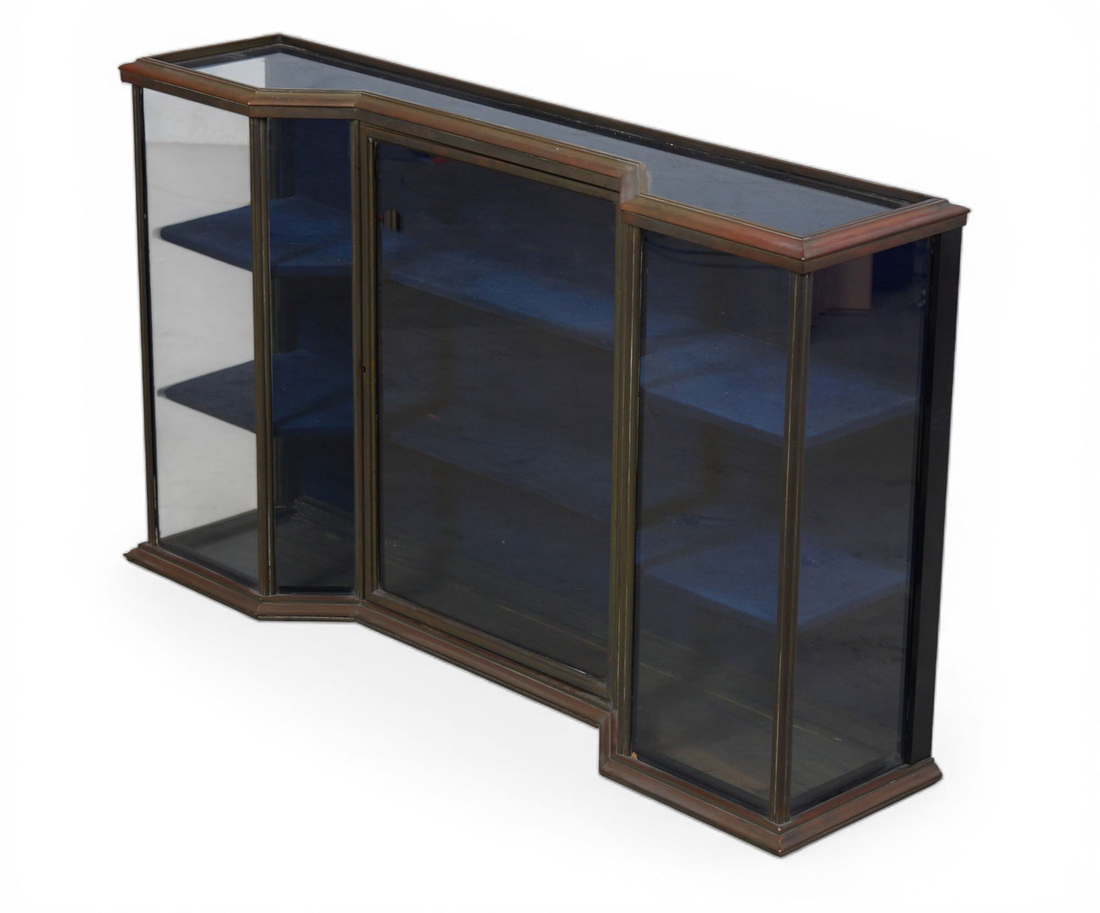 A vintage table top vitrine with brass metal trim: A vintage table top vitrine with brass metal trim height 26 x width 44 x depth 10 1/2 in. (66 x 111.8 x 26.7 cm.)
