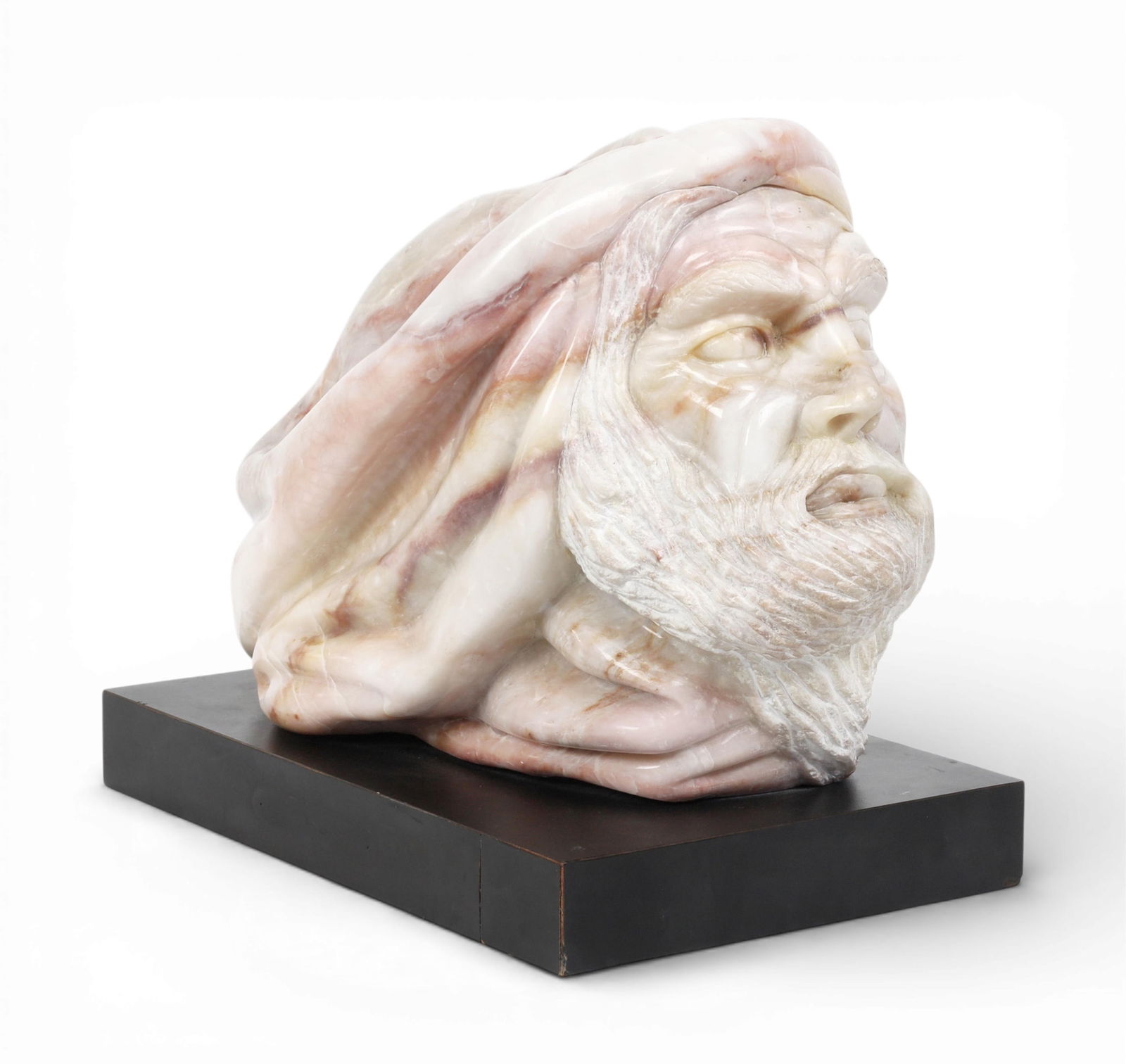A pink alabaster head of a man: A pink alabaster head of a man On ebonized plinth overall 15 x 19 x 10 1/2in (38 x 48 x 27cm)