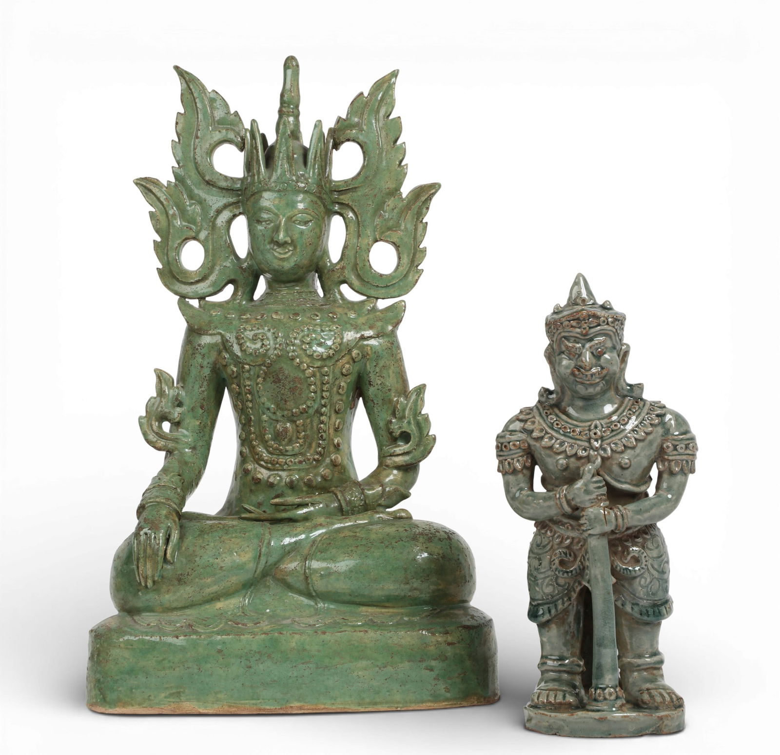 Two Southeast Asian green glazed pottery figures: Sawankhalok and Yaksha: Two Southeast Asian green glazed pottery figures: Sawankhalok and Yaksha larger height 17 1/2in (45cm); width 10 1/2in (27cm); depth 6 1/2in (16.5cm) Provenance: Property from the Preiser Collection.