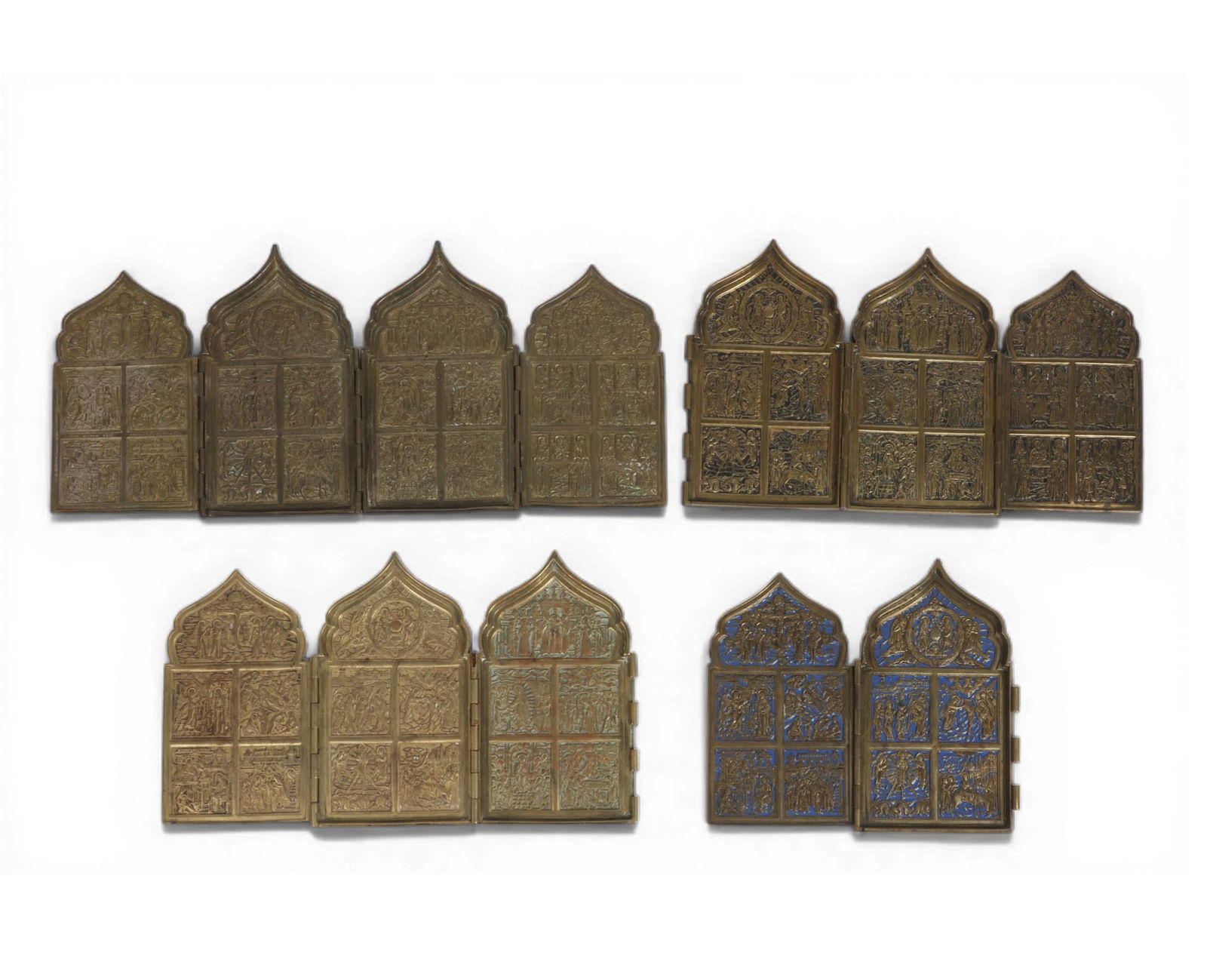 A group of four folding traveling icons: A group of four folding traveling icons Closed: height 7 x width 4 1/2 in. (17.8 x 11.4 cm.)