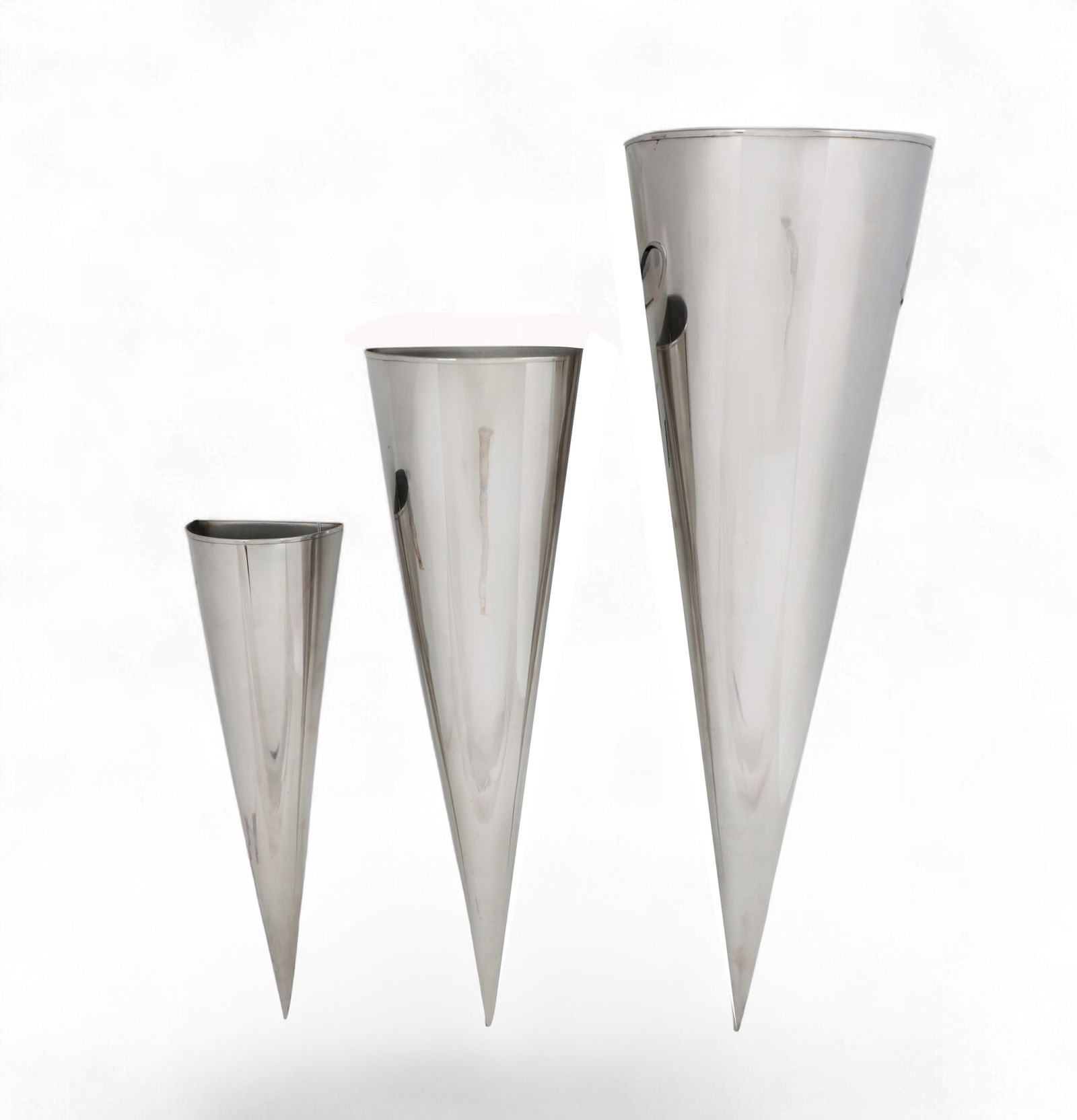 A group of three graduated wall pockets: A group of three graduated wall pockets Largest: height 30 x width 9 in. (76.2 x 22.9 cm.)