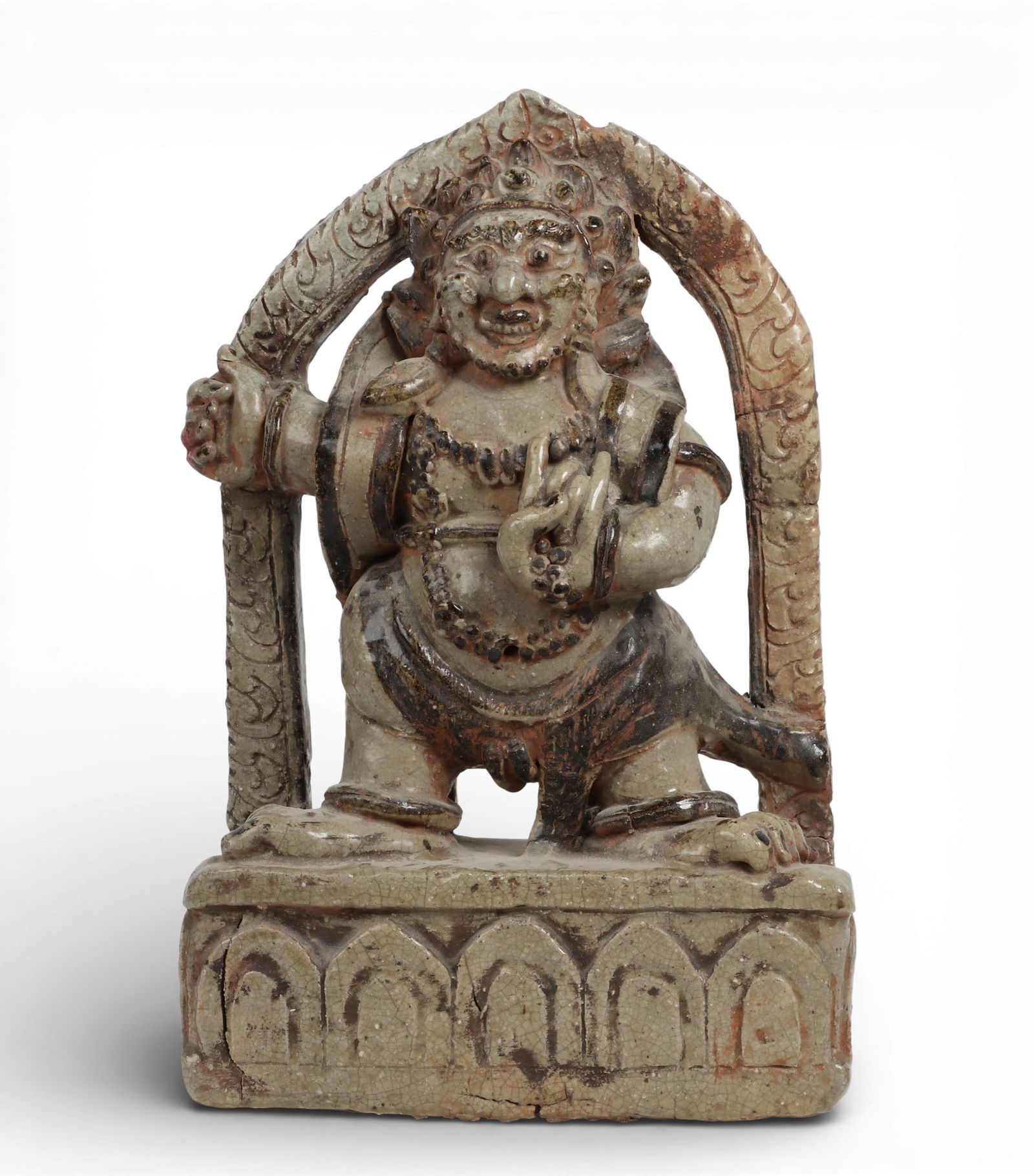 A Southeast Asian glazed pottery model of Mahakala or other Vajrayana diety: A Southeast Asian glazed pottery model of Mahakala or other Vajrayana diety height 20 1/2in (52cm); width 13 1/2in (34cm); depth 5in (12.5cm) Provenance: Property from the Preiser Collection.