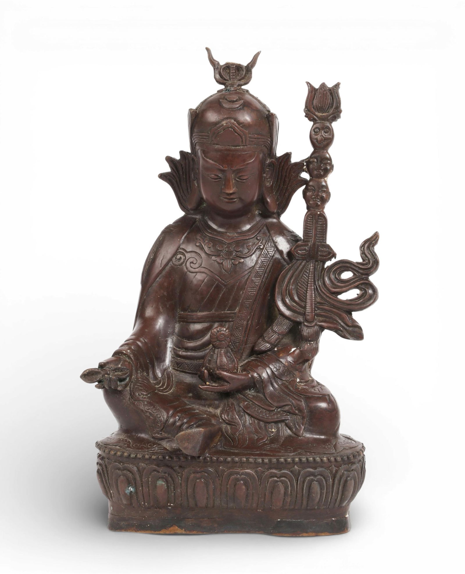 A Southeast Asian cast metal alloy model of seated Padmasambhava, Tibet or greater Vajrayana: A Southeast Asian cast metal alloy model of seated Padmasambhava Tibet or greater Vajrayana diaspora height 11 1/2in (29cm); width 6 1/2in (16.5cm); depth 5in (12.5cm) Provenance: Property from the