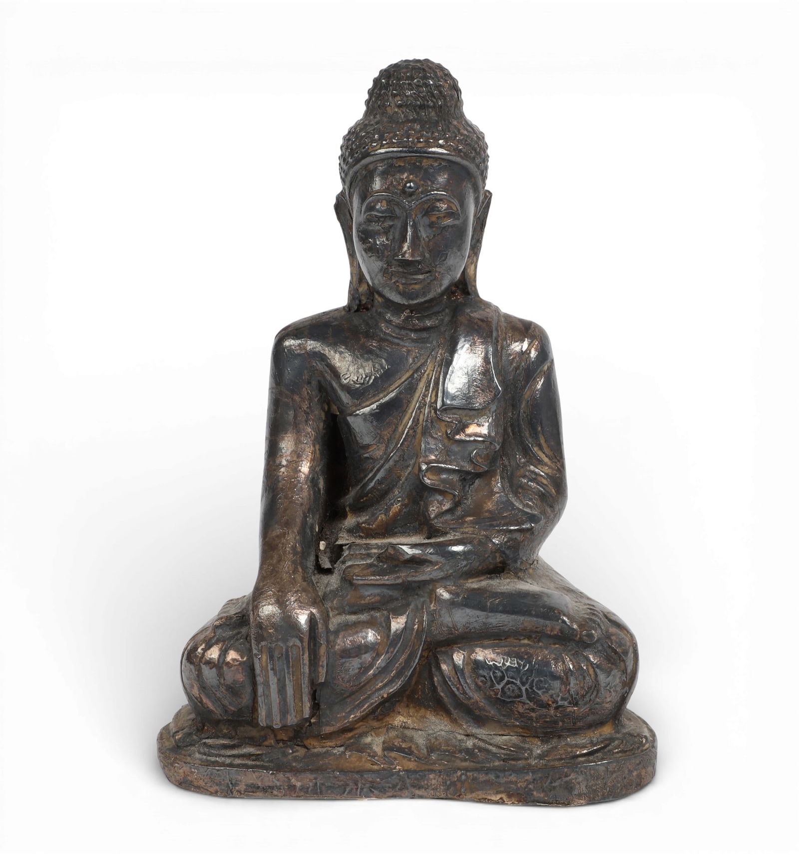 A Southeast Asian metalware clad model of seated Buddha: A Southeast Asian metalware clad model of seated Buddha height 5in (12.5cm); width 3 3/8in (8.5cm); depth 2in (5cm) Provenance: Property from the Preiser Collection.