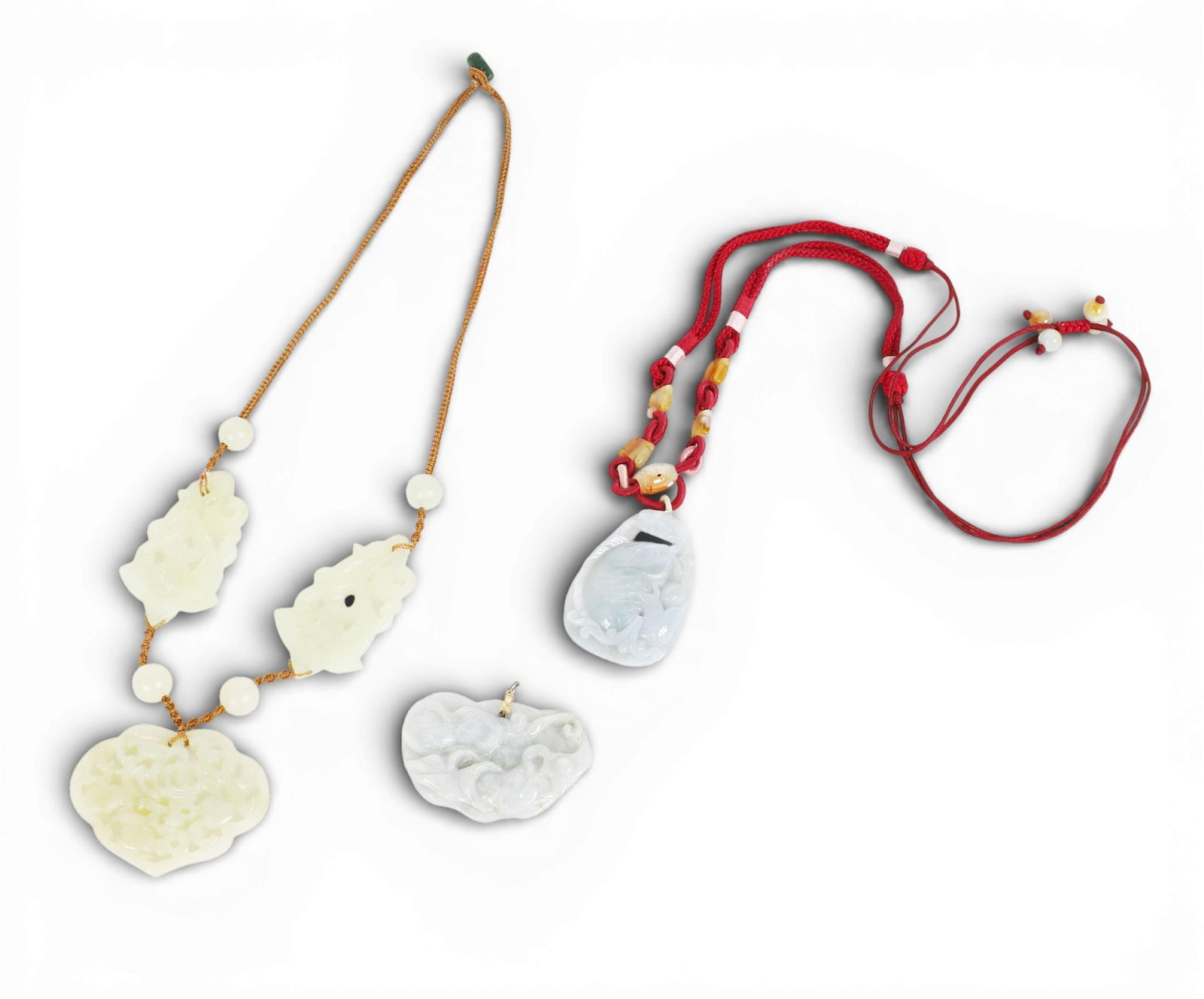 Three Chinese jade and hardstone pendants (1 of 3)