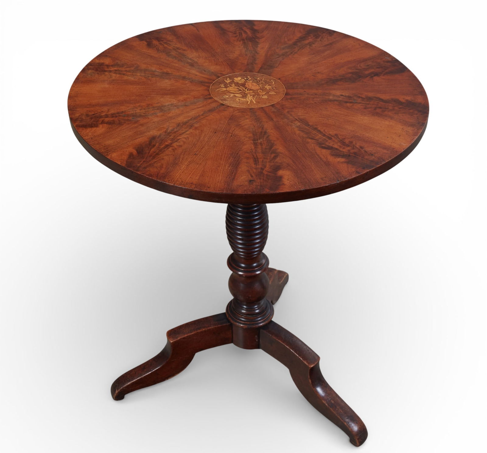 A Continental flame mahogany marquetry inlaid tilt top occasional table: A Continental flame mahogany marquetry inlaid tilt top occasional tablesecond quarter 19th centuryheight 27 1/2in (69cm); diameter 24 1/2in (60.5cm)