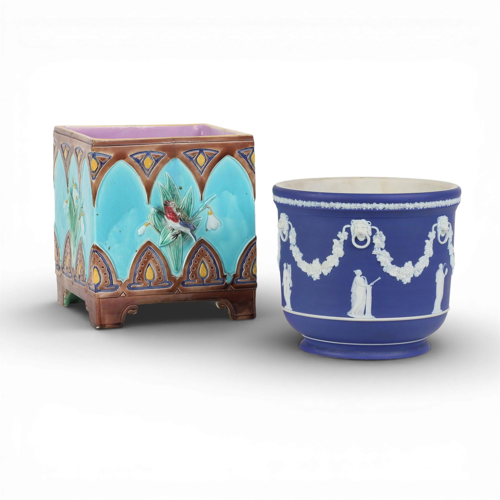 Two English ceramic jardinieres, 19th/20th century: Two English ceramic jardinieres19th/20th centuryComprising a Joseph Holdcroft Majolica square jardiniere and a Wedgwood jasperware jardiniere, both with impressed marks.majolica height 9in (23cm); wid