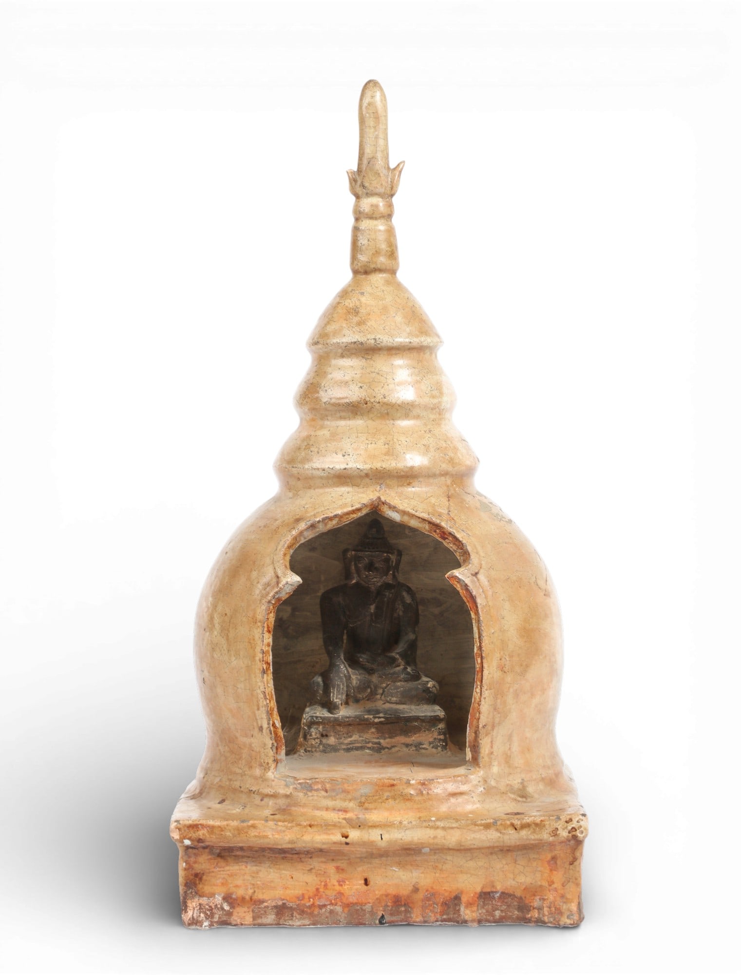 A glazed pottery model of a stupa, probably Southeast Asian: A glazed pottery model of a stupaprobably Southeast Asianheight 19in (48cm); width 9in (23cm) square Provenance:Property from the Preiser Collection.