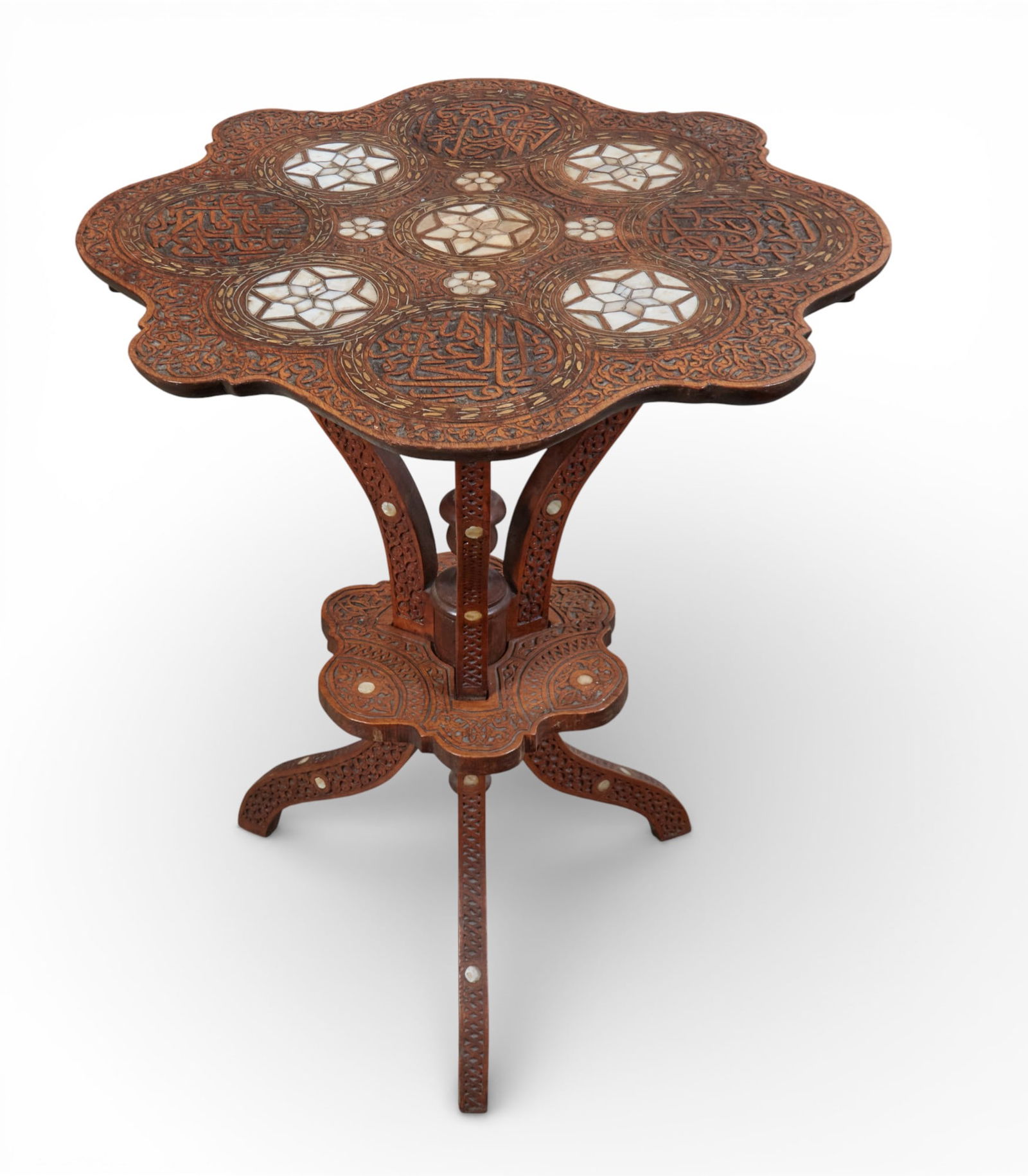 A Levantine shell and metal inlaid carved hardwood table, early 20th century (1 of 6)