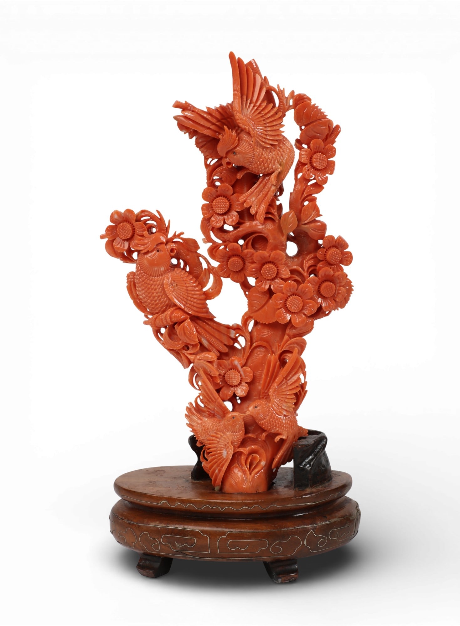 A Chinese carved coral group on hardwood stand: A Chinese carved coral group on hardwood standoverall height 8in (20cm); width 4 1/4in (11cm); depth 2 1/4in (5.5cm); height of coral 6 3/4in (17cm) Provenance:Property from a Private Collection, Beve