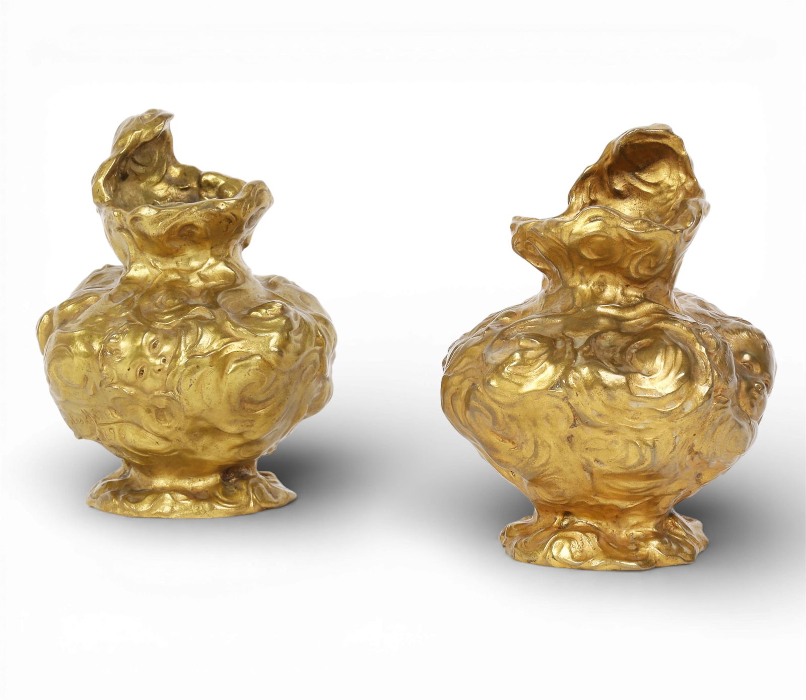 Two gilt bronze Face vases, after the model by Jules Andre Meliodon (French, 1867-1938): Two gilt bronze Face vases after the model by Jules Andre Meliodon (French, 1867-1938) 20th century Signed in the maquette Jules Meliodon / 1896. height 6in (15cm); width 5in (12.5cm)