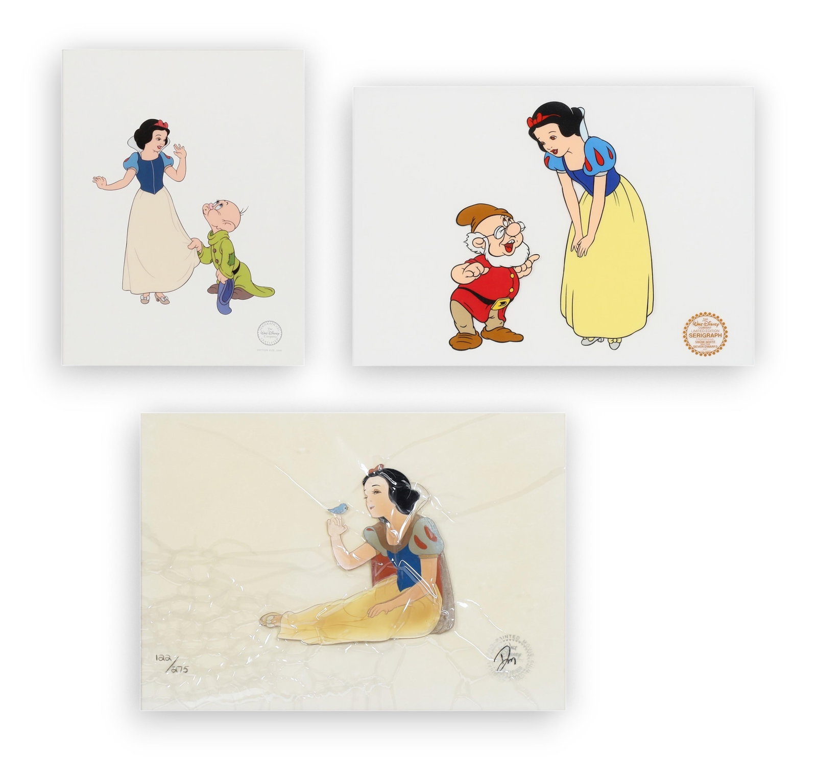 Snow White and the Seven Dwarfs, 1937: A group of three animation cels: Snow White and the Seven Dwarfs, 1937: A group of three animation celslot includes three animation production cels: one numbered 122 / 275 edition of Snow White conversing with the Bluebird, together