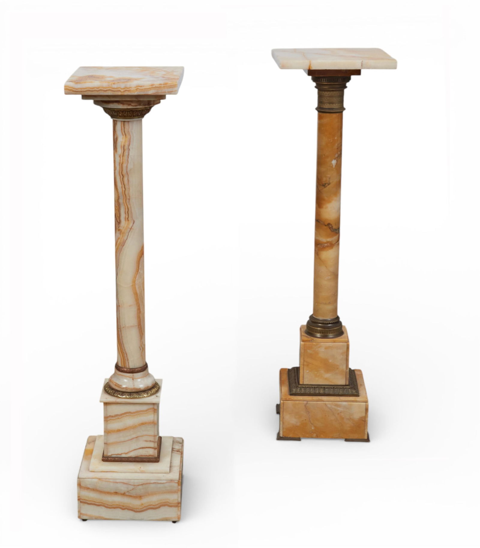 Two gilt bronze mounted marble and onyx pedestals: Two gilt bronze mounted marble and onyx pedestals Comprising a Siena marble pedestal with a square onyx top plinth, the other an onyx pedestal with a square rotating top plinth. largest height 42in