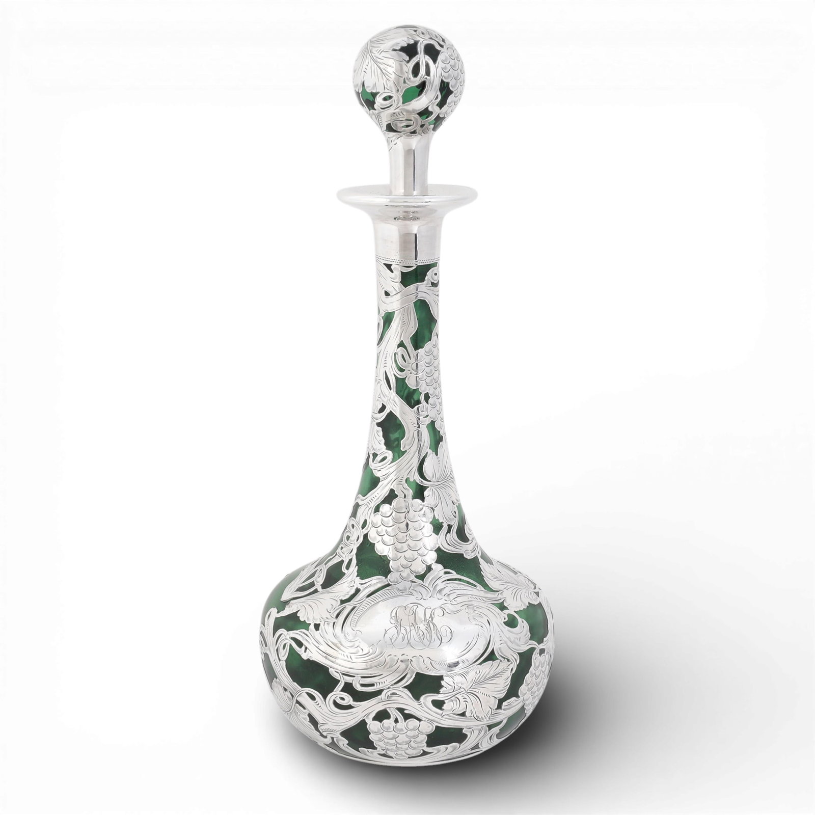 A La Pierre silver deposit and emerald glass wine decanter, circa 1900: A La Pierre silver deposit and emerald glass wine decanter circa 1900 Monogrammed. height 13in (32.5cm); diameter 5 1/2in (14cm) Provenance: Property from a Private Pasadena Collection.