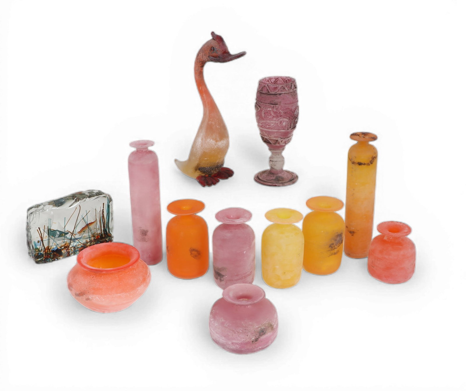 A group of eleven assorted Murano colored glass Scavo table decorations, ARS Cenedese, modern: A group of eleven assorted Murano colored glass Scavo table decorations ARS Cenedese modern Comprising nine bottle vases, a goblet, and a model of a bird together with a small aquarium, each with
