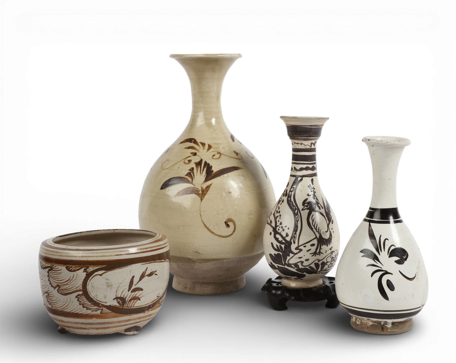 A four piece group of Chinese cizhou style earthenware vessels (1 of 12)