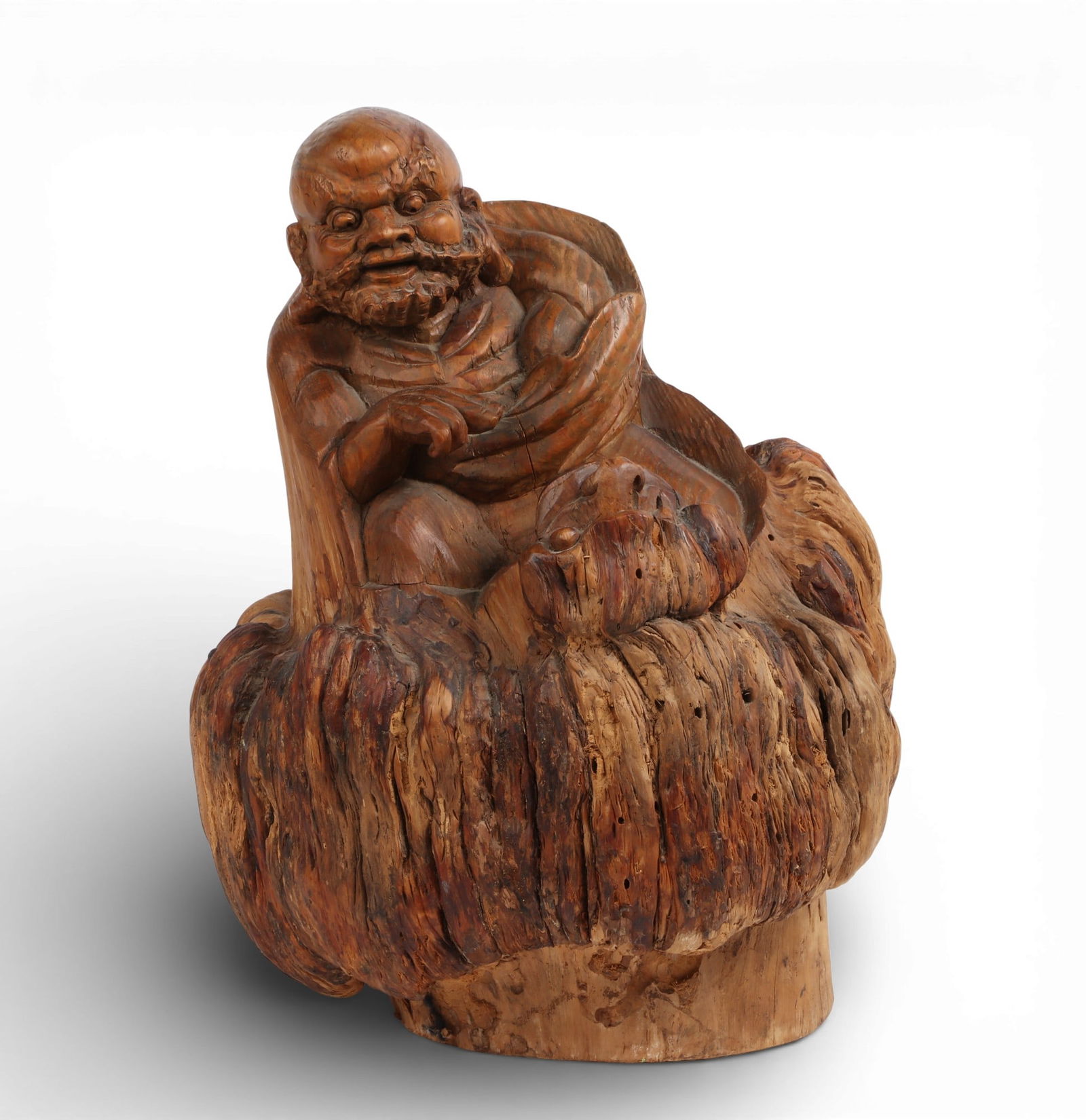 A Chinese carved hardwood trunk section model of Bodhidharma: A Chinese carved hardwood trunk section model of Bodhidharmaheight 19in (47.5cm); width 14in (35cm); depth 12in (30cm) Provenance:Property from a Private Collection, San Francisco, California.
