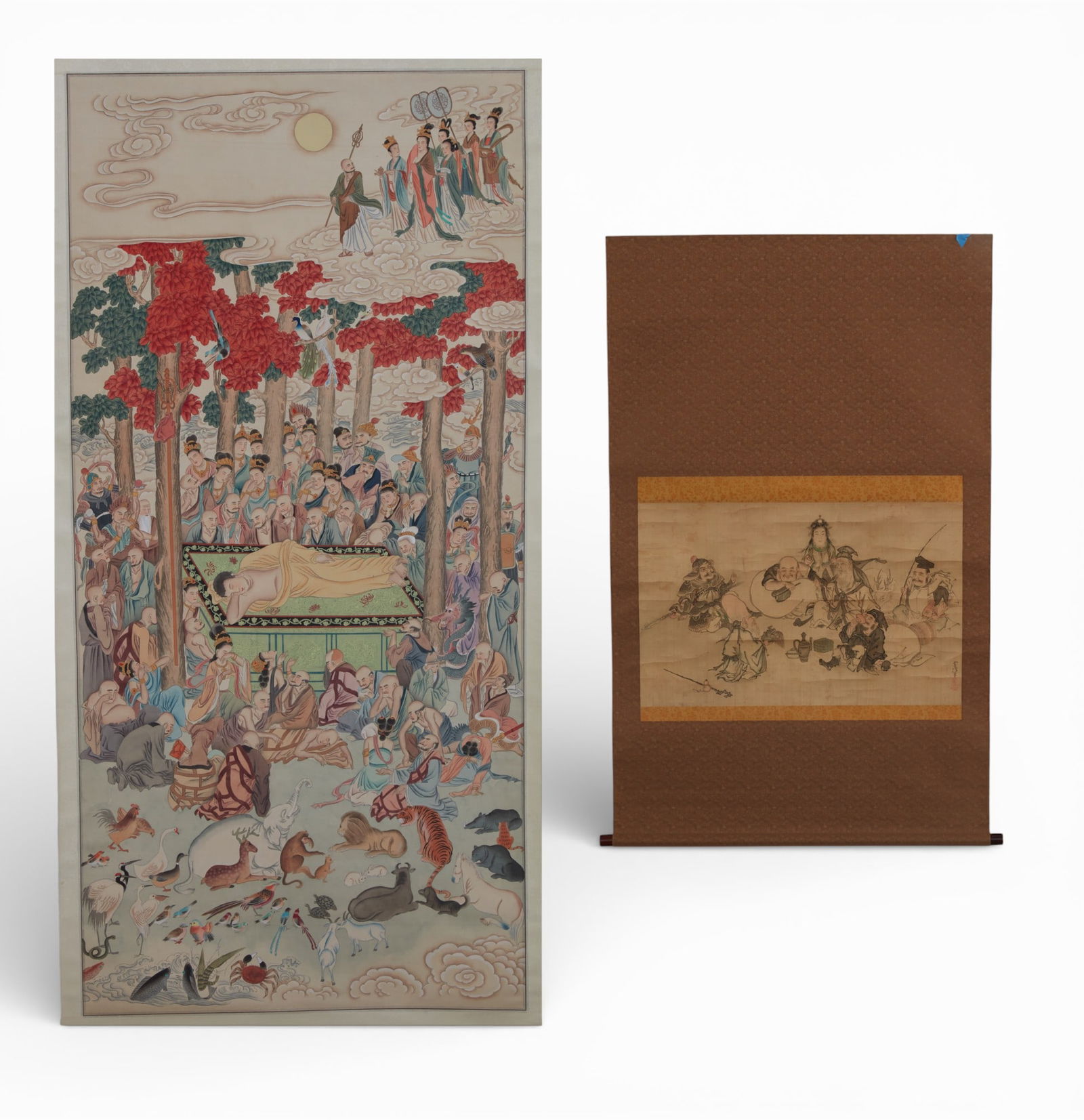 Two Japanese devotional scroll paintings: Seven Lucky Gods and Parinirvana: Two Japanese devotional scroll paintings: Seven Lucky Gods and ParinirvanaOne with inscrption and seals.larger image 56 x 27in (142 x 69cm); overall 81 1/2 x 30in (207 x 76cm)