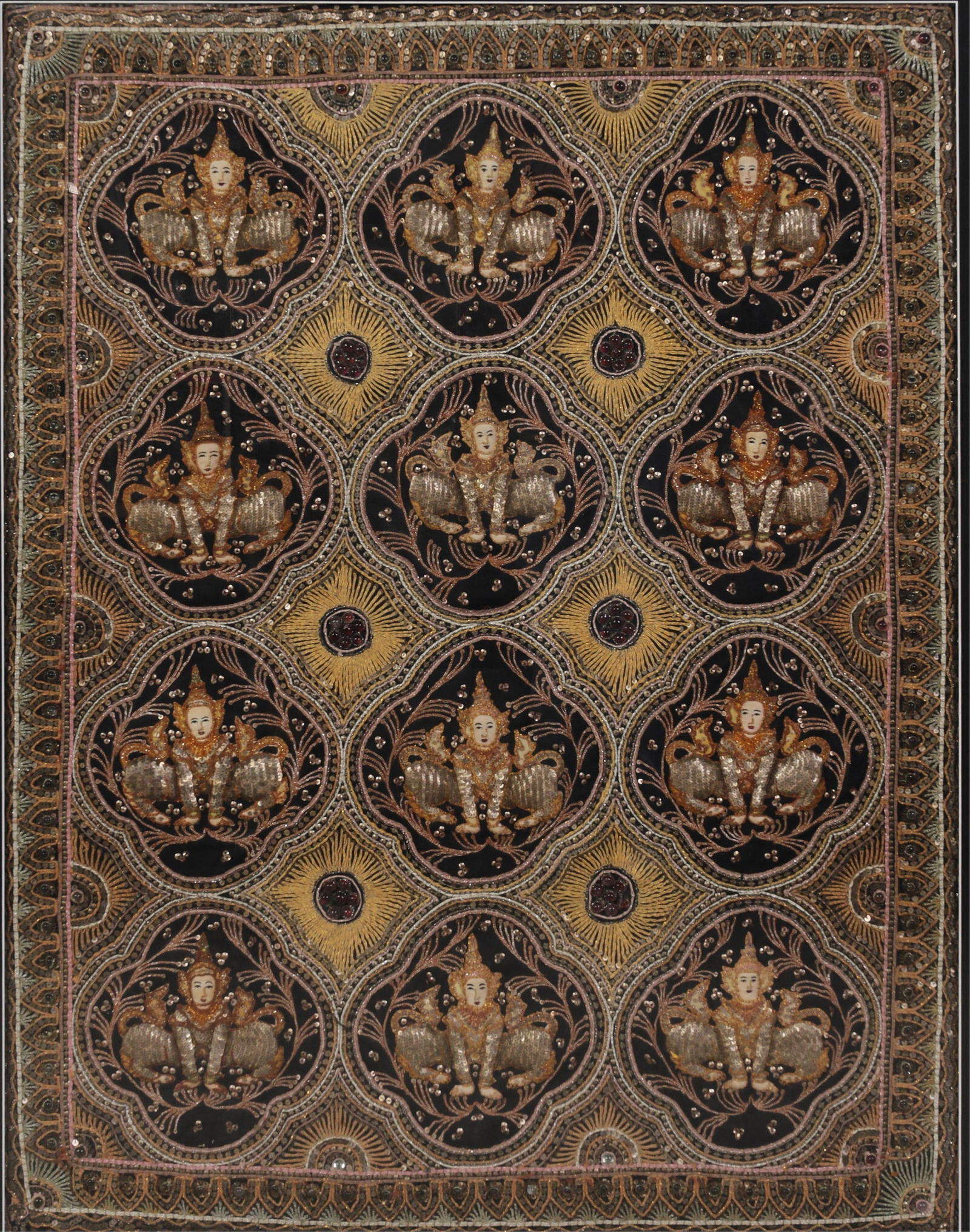 An imposing Burmese Kalaga tapestry with twelve jeweled Buddhas: An imposing Burmese Kalaga tapestry with twelve jeweled Buddhas 44 x 34in (112 x 87cm) Provenance: Property from the Collection of Loni Anderson