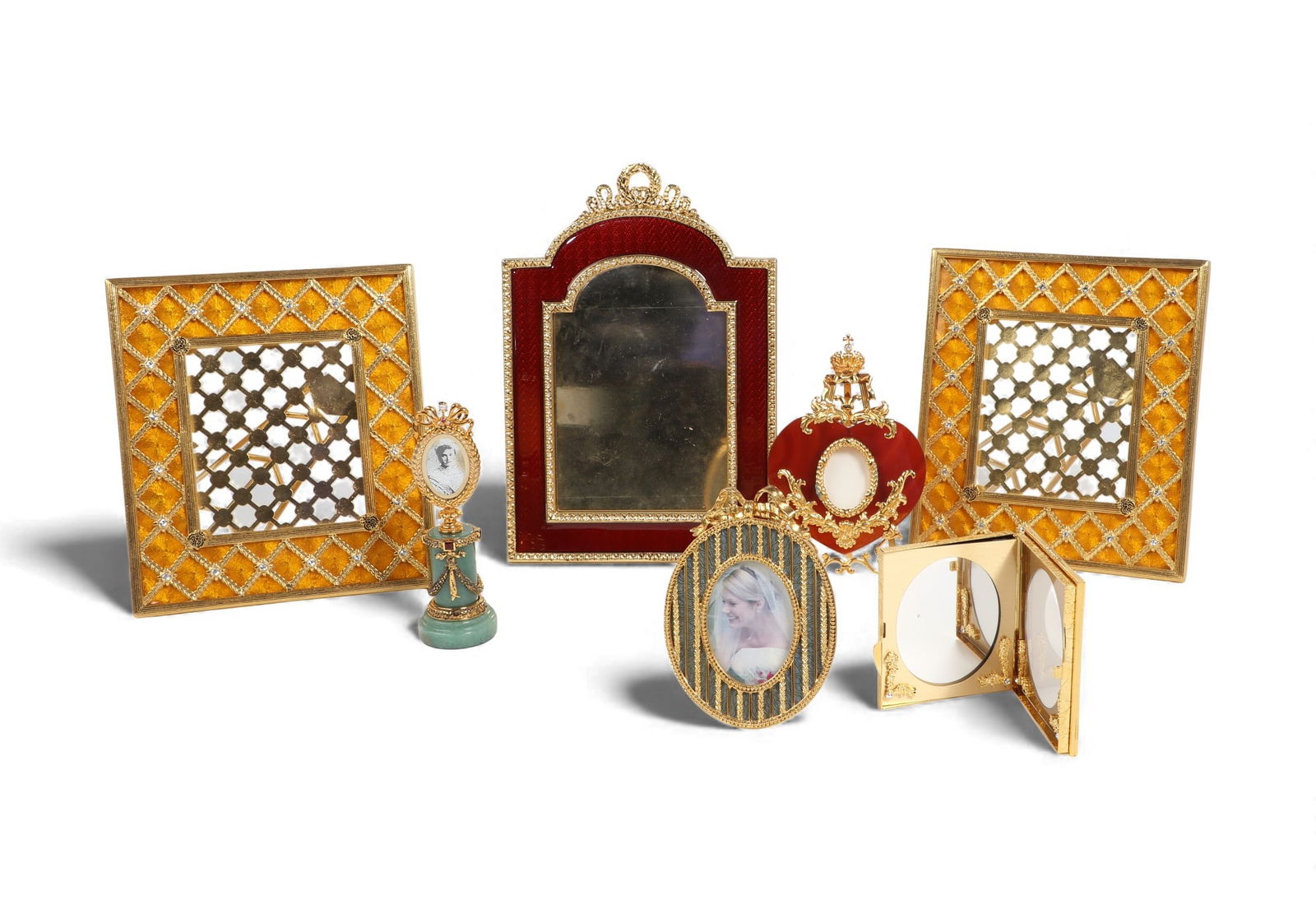 A group of seven modern Faberge gilt metal enameled picture frames: A group of seven modern Faberge gilt metal enameled picture framesIncluding a pair of gold enamel and crystal square frames, a miniature gilt sterling oval frame on green hardstone pedestal stamped 92