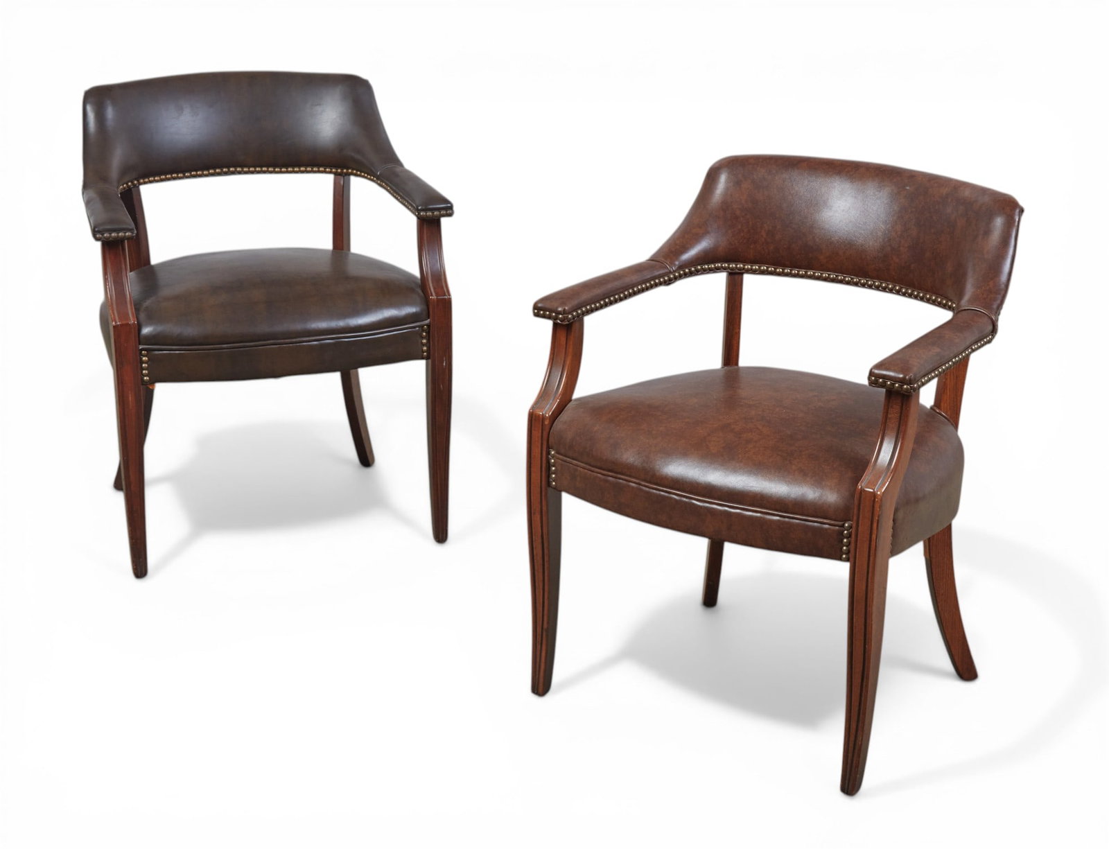 A pair of stained beechwood armchairs: A pair of stained beechwood armchairs height 30 x width 24 x depth 22 in. (76.2 x 61 x 55.9 cm.)