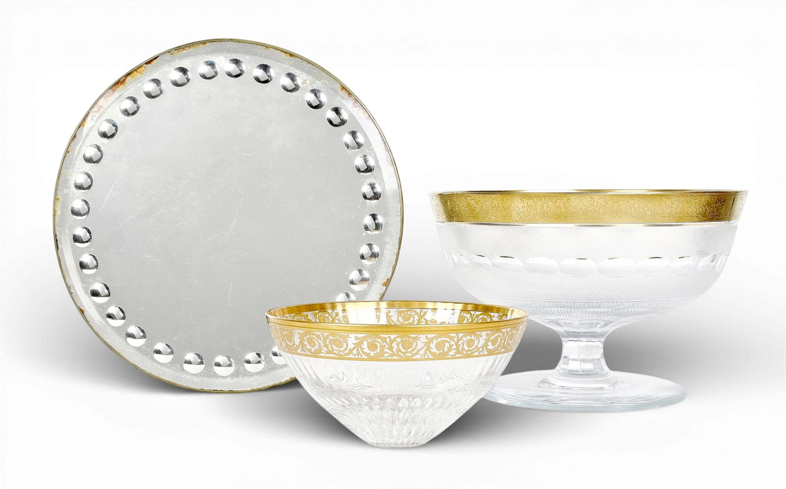 Two gilt heighted glass bowls and a mirrored plateau, modern: Two gilt heighted glass bowls and a mirrored plateau modern larger bowl height 8 1/4in (21cm); diameter 12 1/2in (32cm)