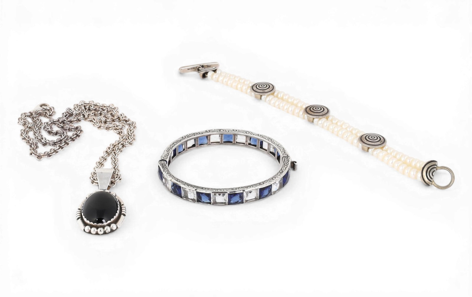 A group of three sterling silver jewelry consisting of a bangle bracelet, a bracelet with faux (1 of 5)