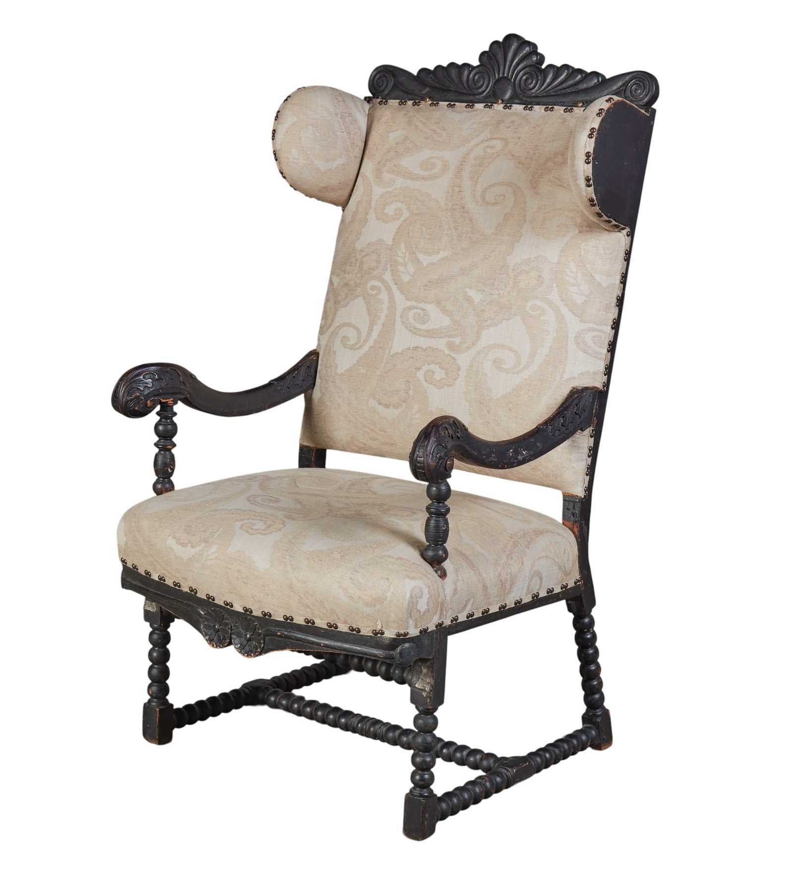 A hand carved armchair with scroll arm rests: A hand carved armchair with scroll arm rests height 51 x width 30 x depth 31 in. (129.5 x 76.2 x 78.7 cm.)
