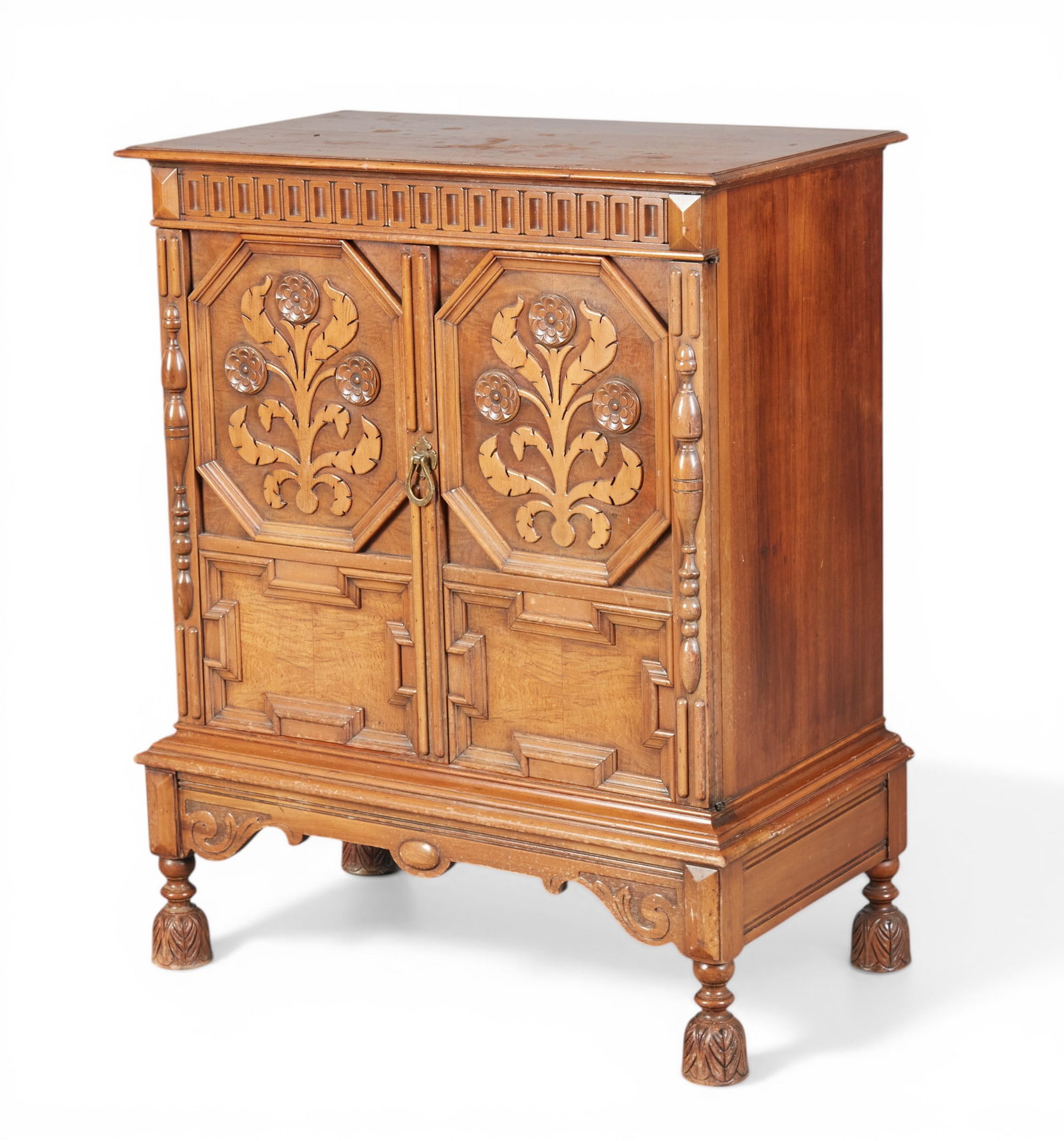 A William and Mary style two door cabinet with floral carvings: A William and Mary style two door cabinet with floral carvings missing the back panel height 42 x width 33 1/2 x depth 19 in. (106.7 x 85.1 x 48.3 cm.)