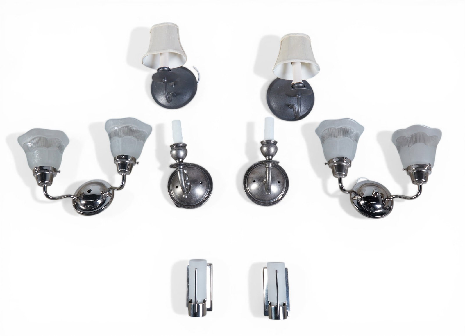 A group of eight wall sconces: A group of eight wall sconces Largest Pair: height 8 1/2 x width 11 1/2 in. (21.6 x 29.2 cm.)