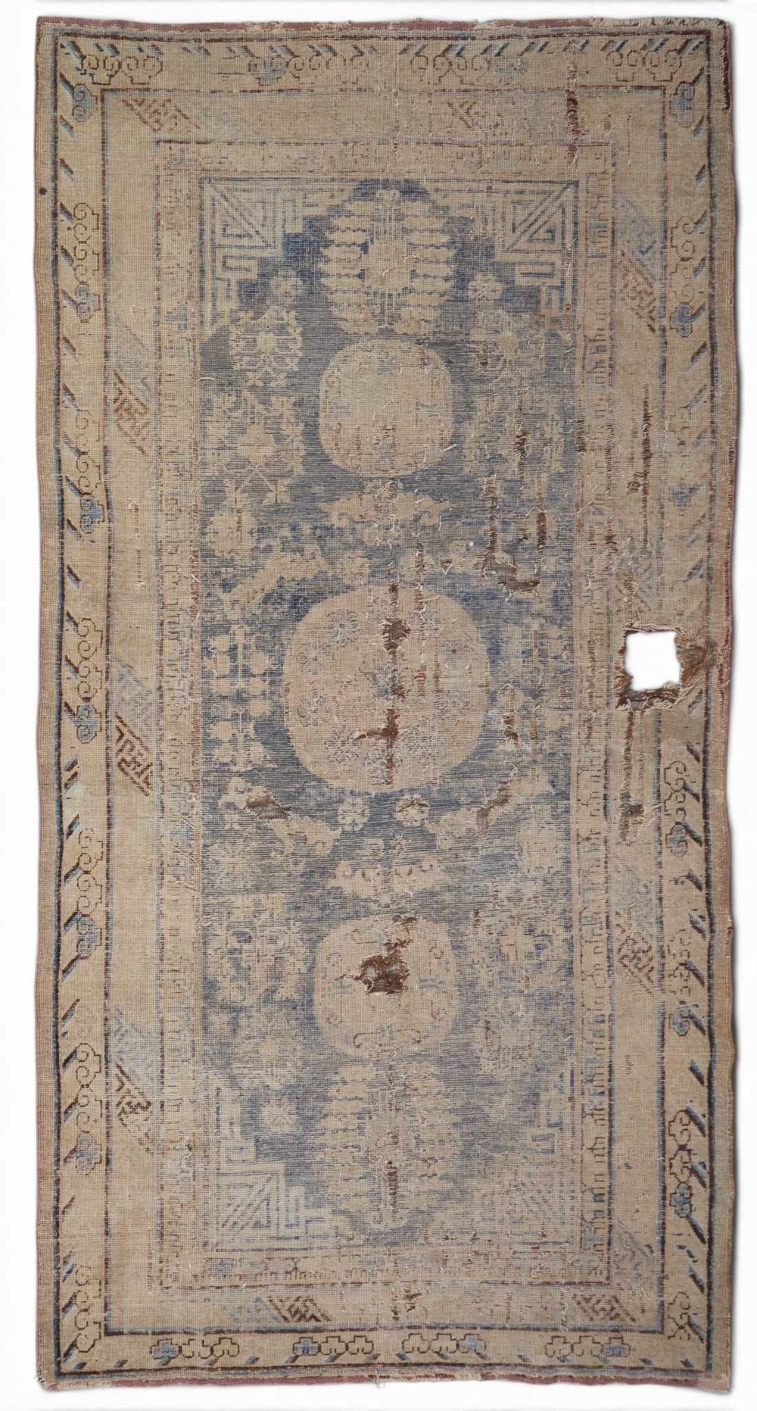 A Khotan rug, East Turkestan: A Khotan rug East Turkestan approximately 4ft 6in x 9ft 2in (140x280cm)