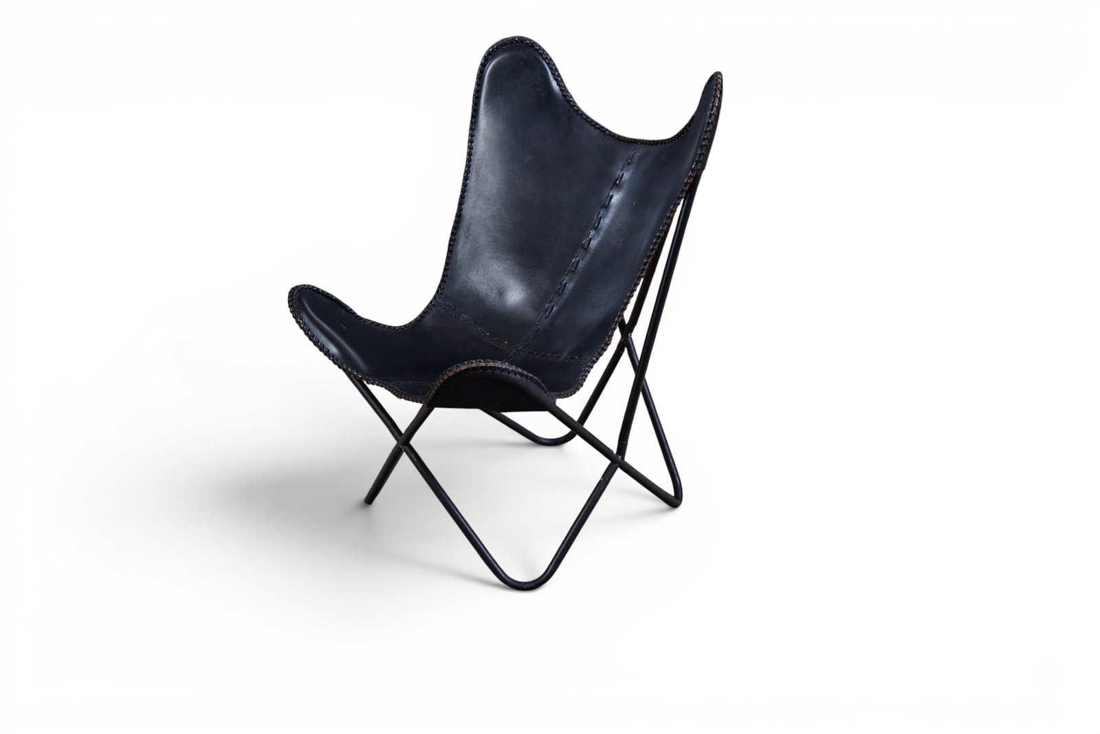 A butterfly lounge chair: A butterfly lounge chair Height 36in; Width 27 1/2 in; Depth of seat 13in
