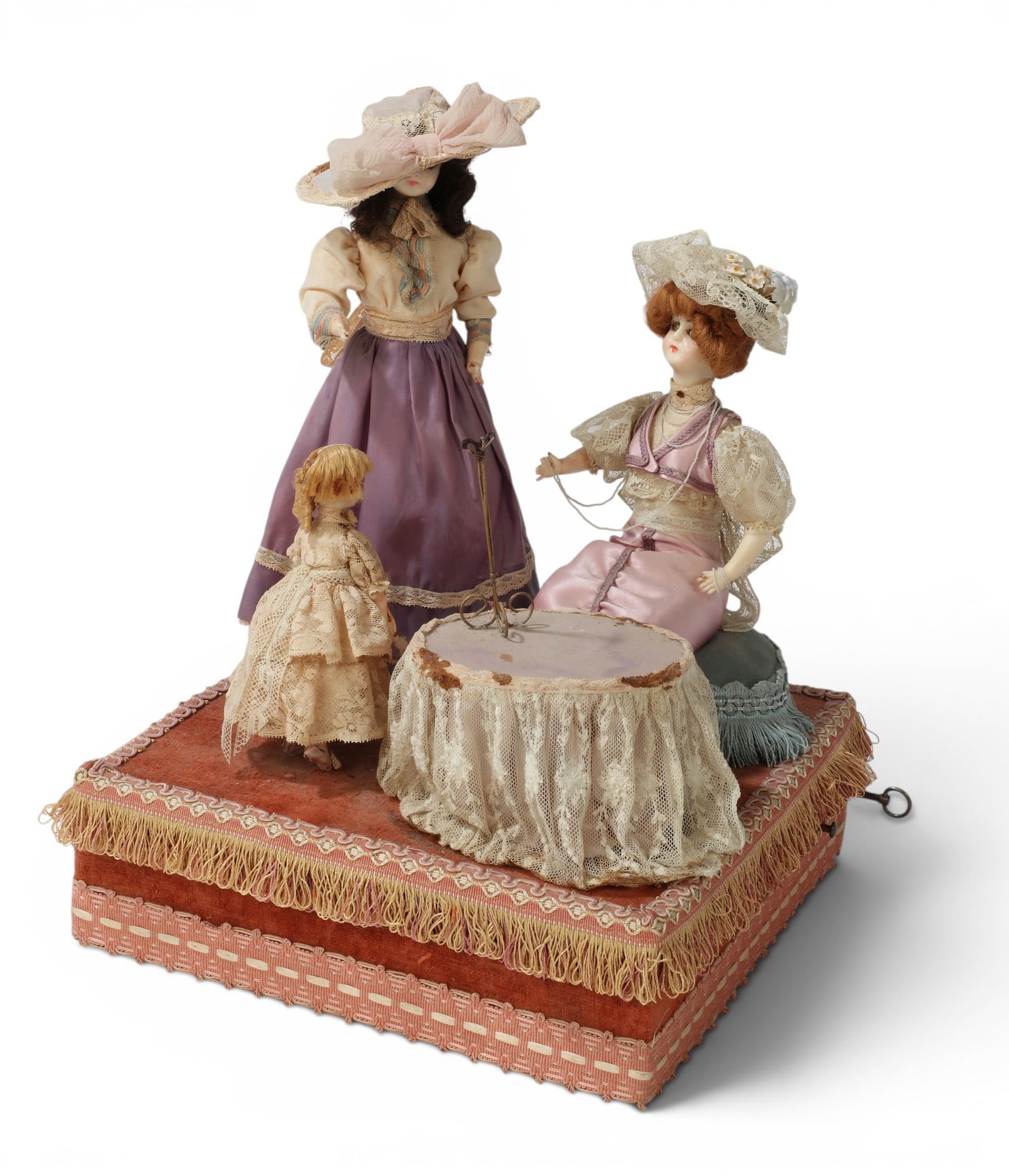 An automaton of two women and a child: An automaton of two women and a child height 16 x width 12 x depth 12 in. (40.6 x 30.5 x 30.5 cm.)