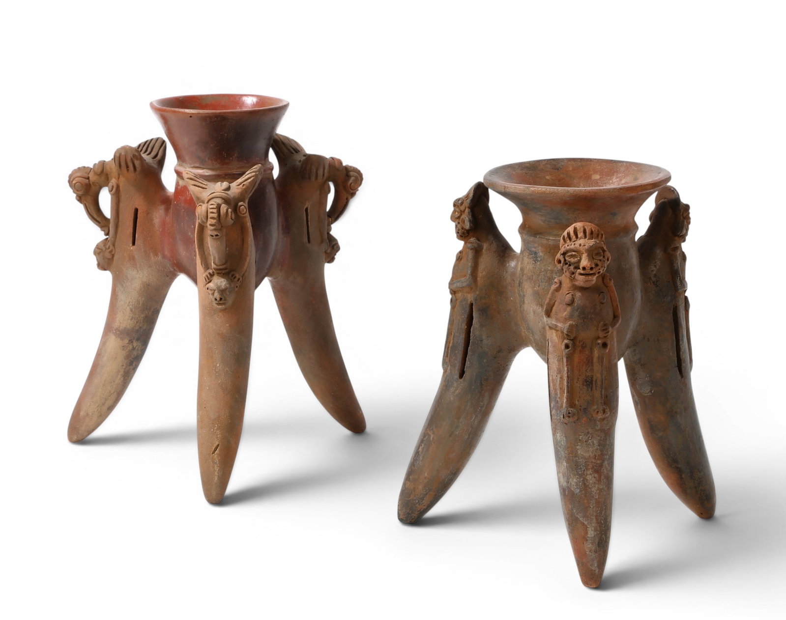 A pair of Guanacaste (Costa Rica) Nicoya redware tripod rattler vessels: A pair of Guanacaste (Costa Rica) Nicoya redware tripod rattler vessels height 11 in. (27.9 cm.)