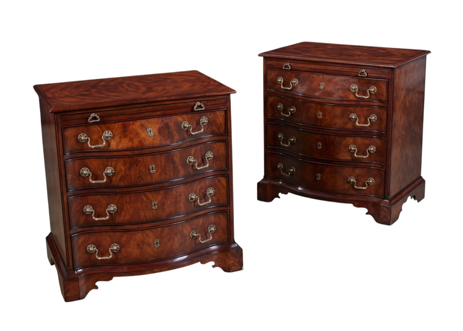 A pair of mahogany serpentine chests with four drawers by Theodore Alexander: A pair of mahogany serpentine chests with four drawers by Theodore Alexander height 32 x width 30 x depth 20 in. (81.3 x 76.2 x 50.8 cm.)