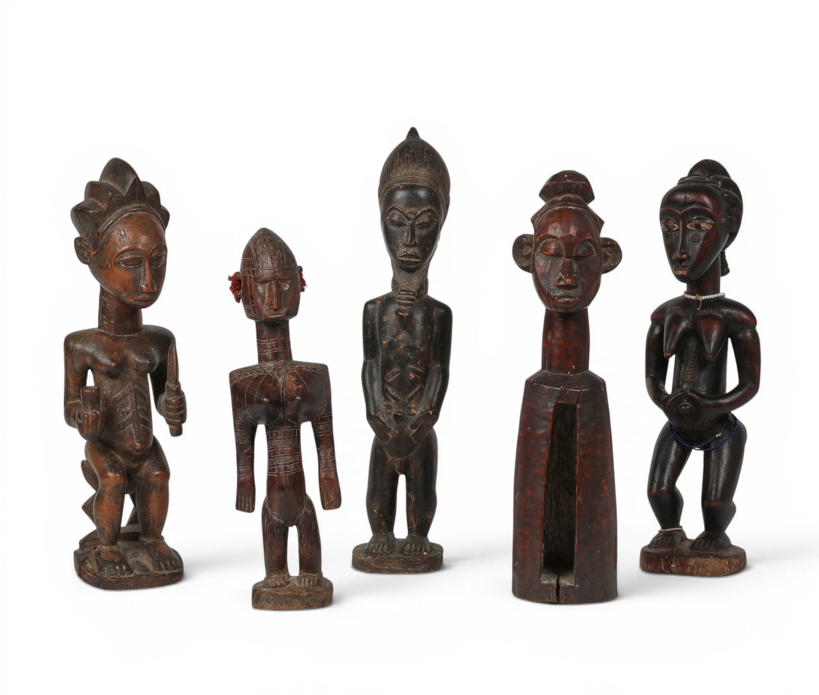 A group of five African hardwood figures, possibly Central African Fang and Baule cultures (1 of 4)