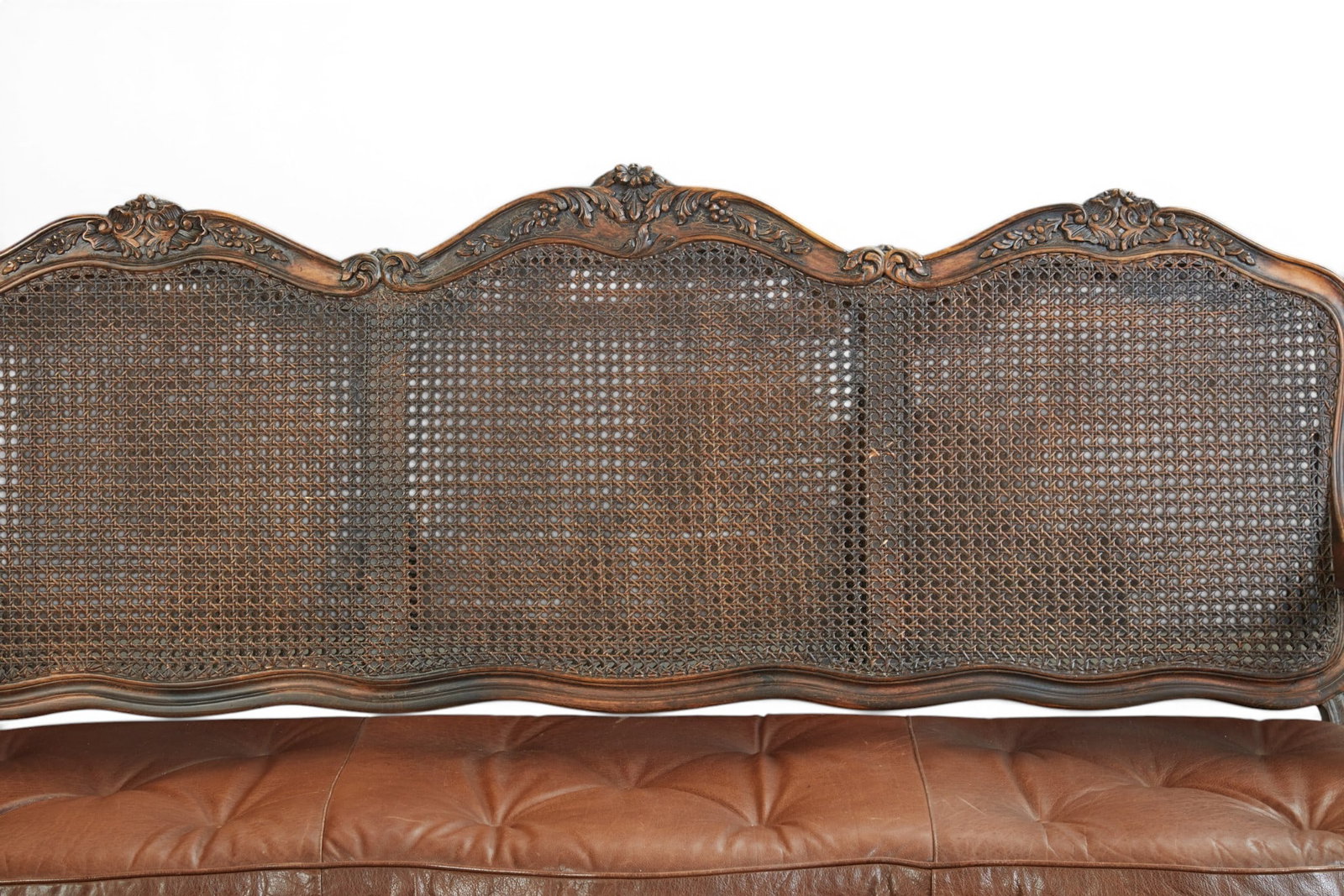 A cane back settee - 3