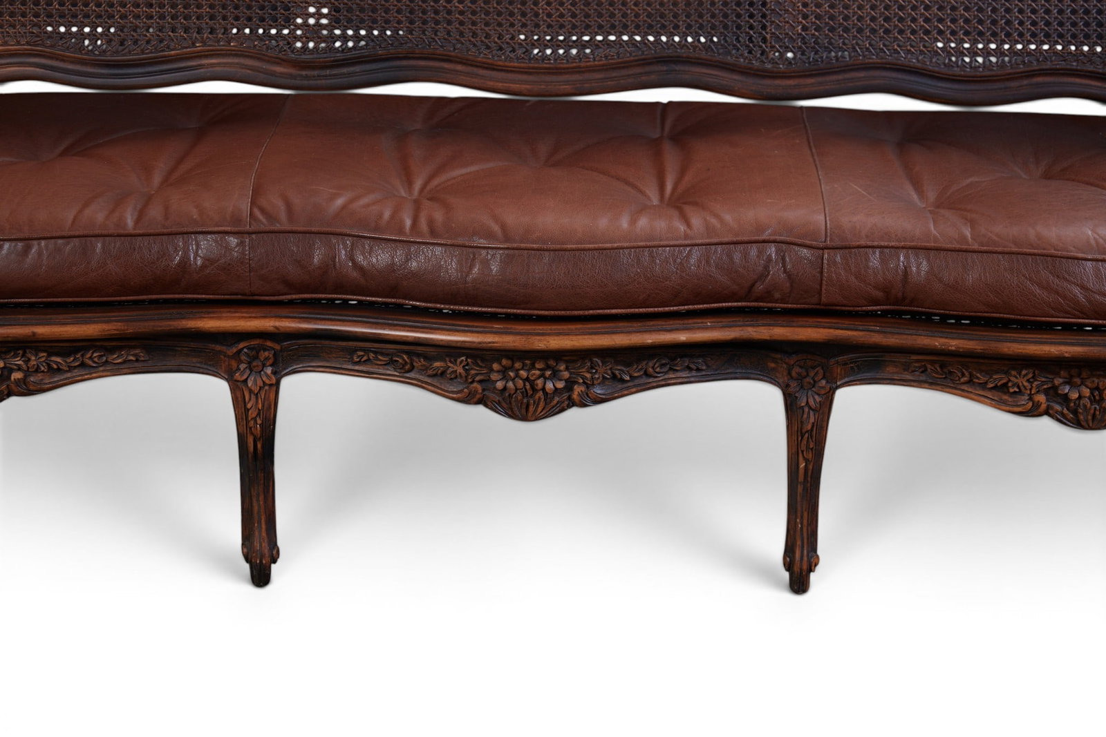 A cane back settee - 4