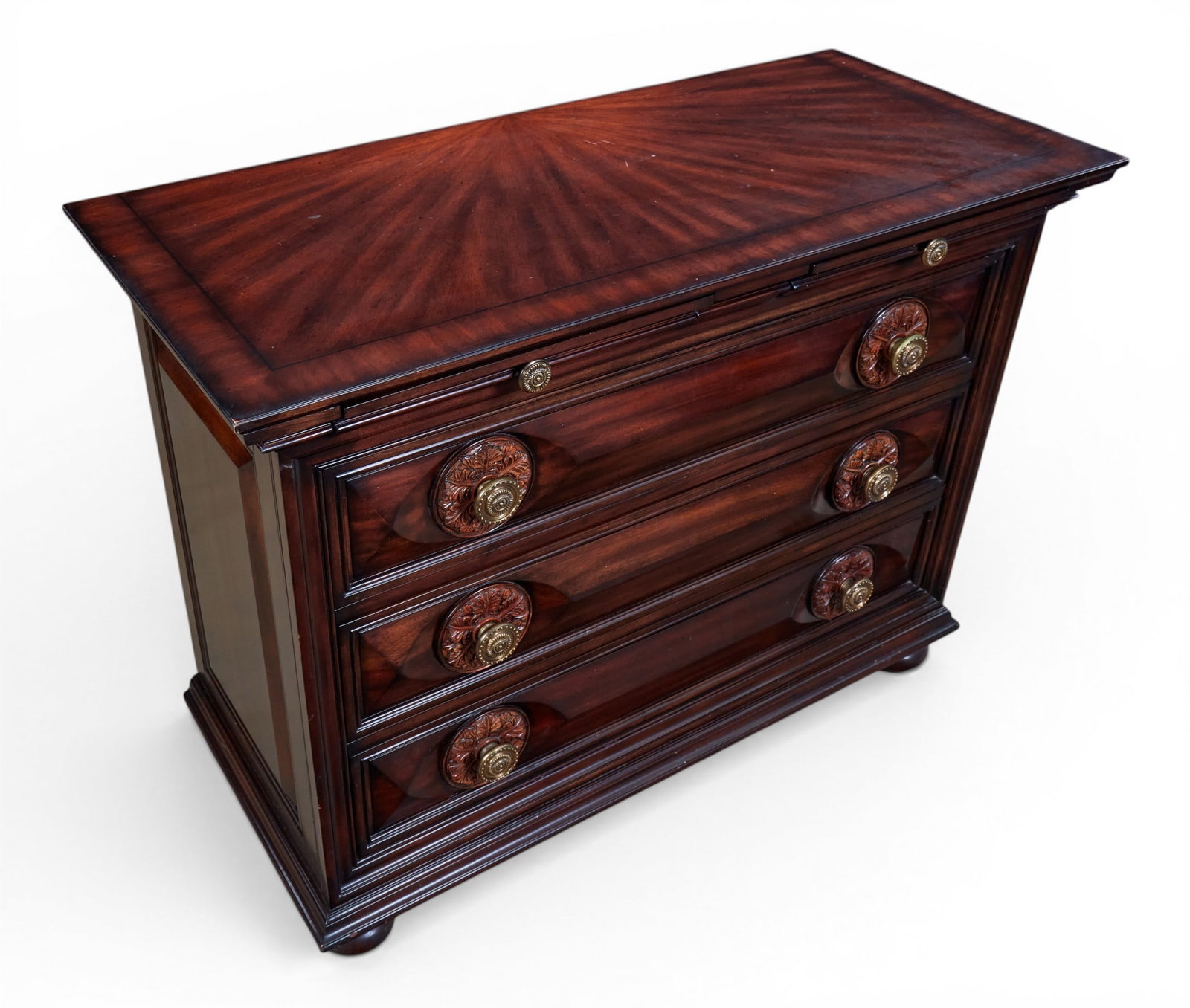 A three drawer chest: A three drawer chest height 34 x width 45 x depth 20 in. (86.4 x 114.3 x 50.8 cm.)