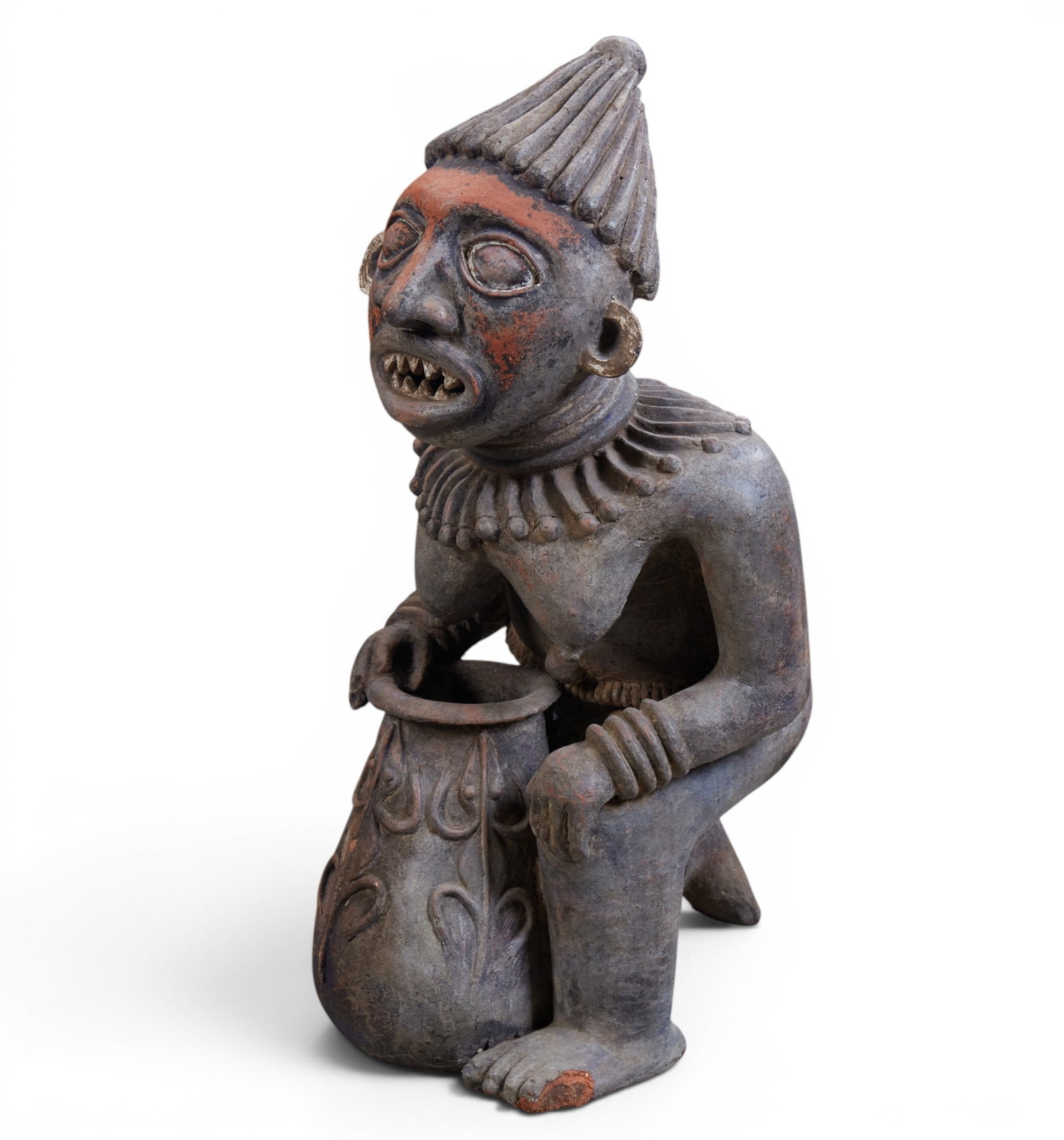 A wooden block carved kneeling figure of a woman, West Africa: A wooden block carved kneeling figure of a woman, West Africa height 40 x width 19 x depth 17 in. (101.6 x 48.3 x 43.2 cm.)