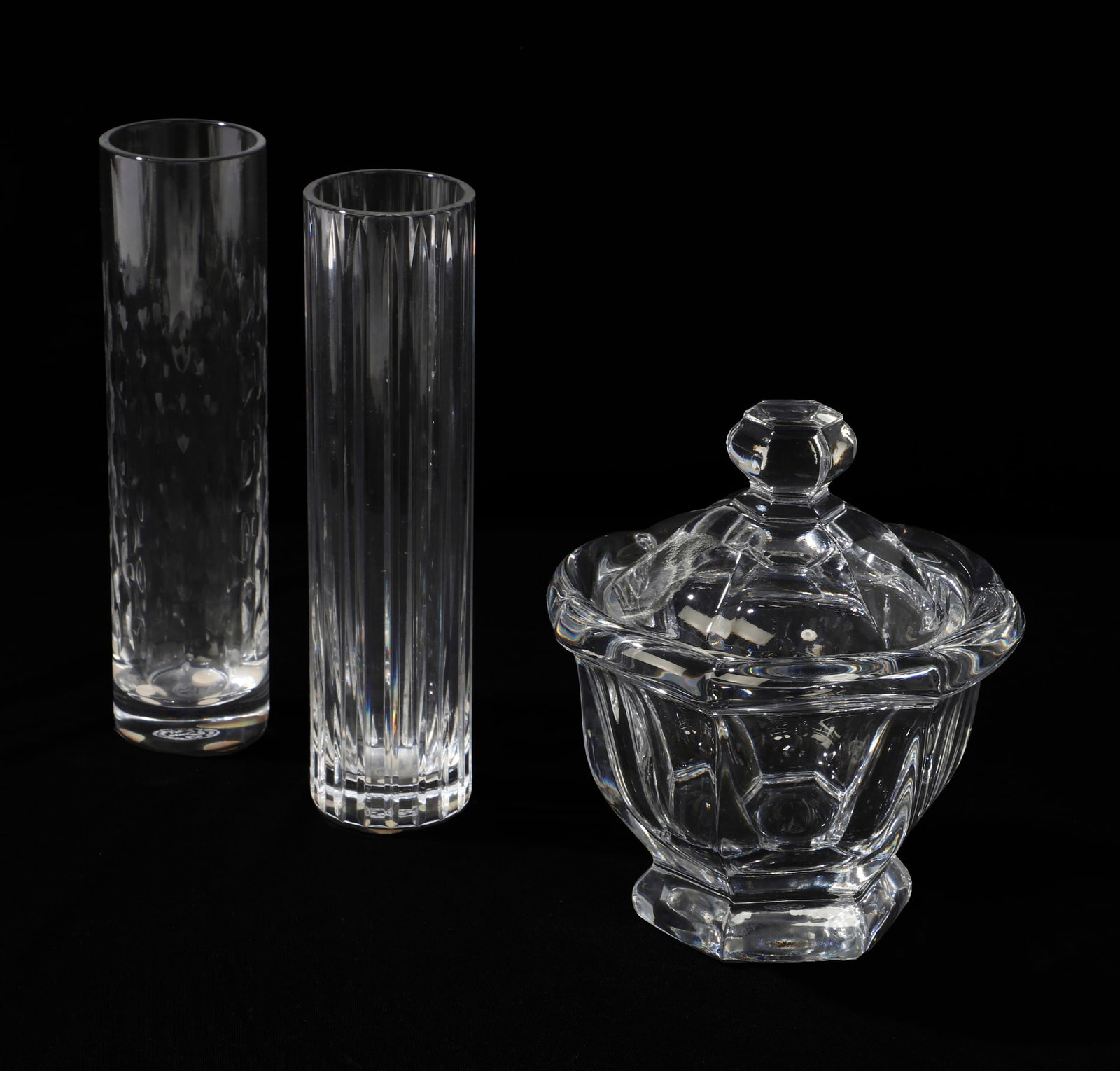 A group of three Baccarat crystal: A group of three Baccarat crystal Tallest: height 7 x diameter 1 3/4 in. (17.8 x 4.4 cm.)