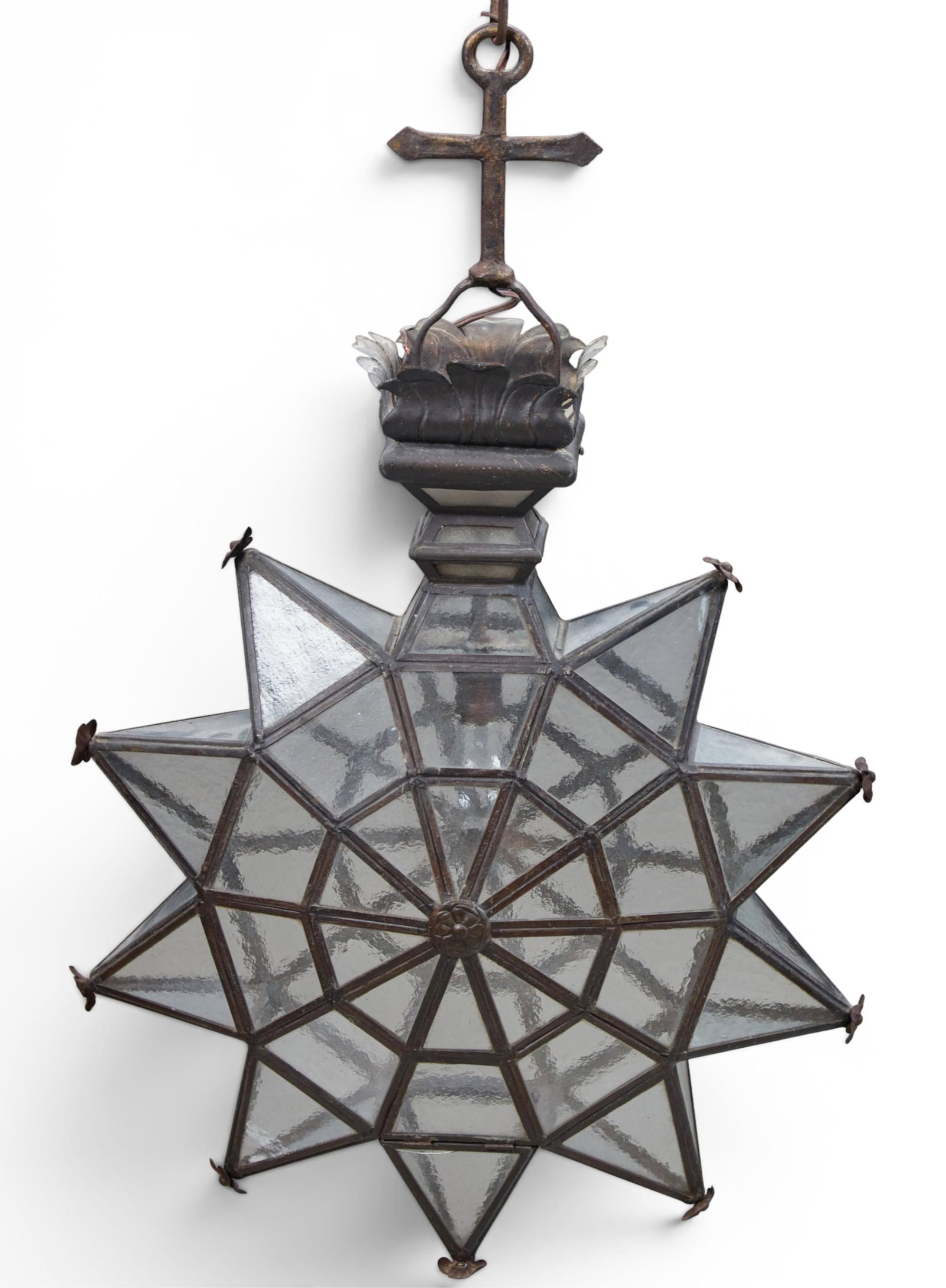 A patinated metal and glass star form pendant lantern, modern: A patinated metal and glass star form pendant lantern modern height 40in (102cm); width 24in (61cm); depth 8in (20cm)