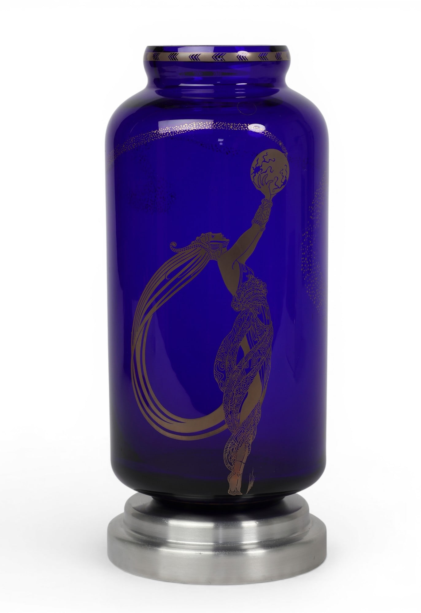 An Erte cobalt blue glass vase on a polished metal base: An Erte cobalt blue glass vase on a polished metal base W/stand: height 11 1/2 in. (29.2 cm.)