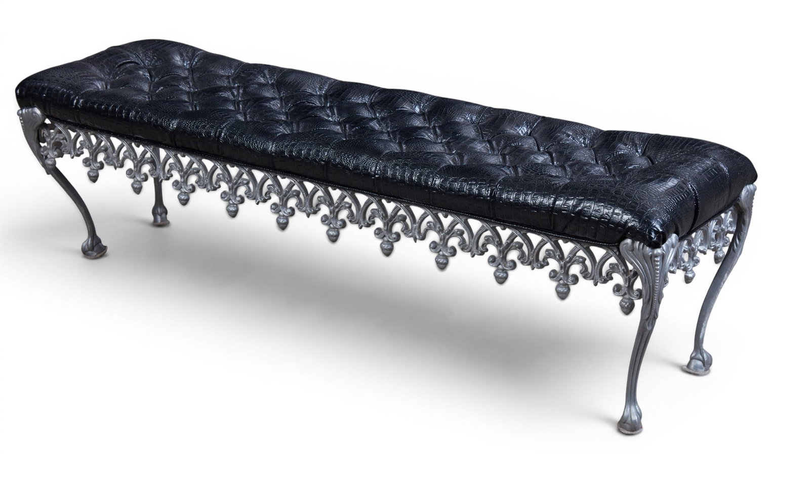 A wrought iron bench: A wrought iron bench height 17 x width 16 x length 60 in. (43.2 x 40.6 x 152.4 cm.)