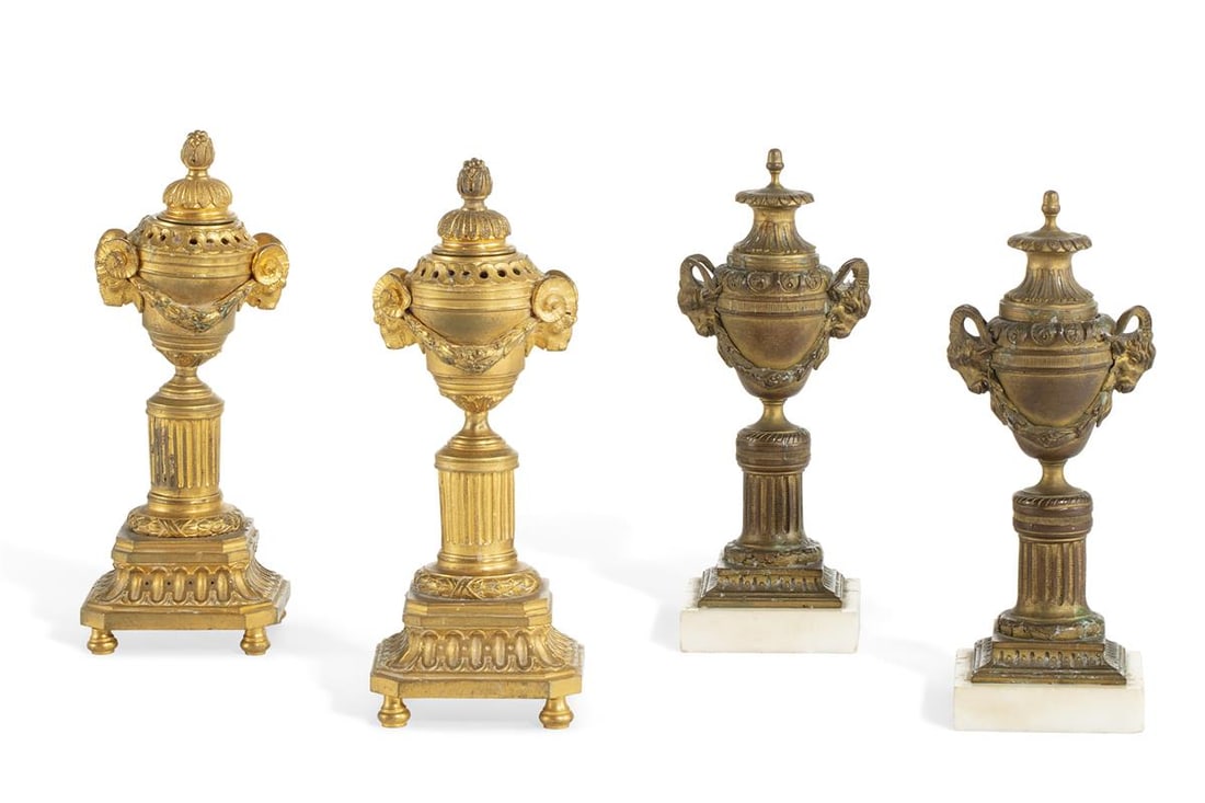 Two similar pairs of Louis XVI style bronze cassoulettes late 19th century: Two similar pairs of Louis XVI style bronze cassoulettes late 19th century One pair gilt bronze, the other pair on white marble plinths. (4) the larger pair height 9in (23cm) Provenance: Property
