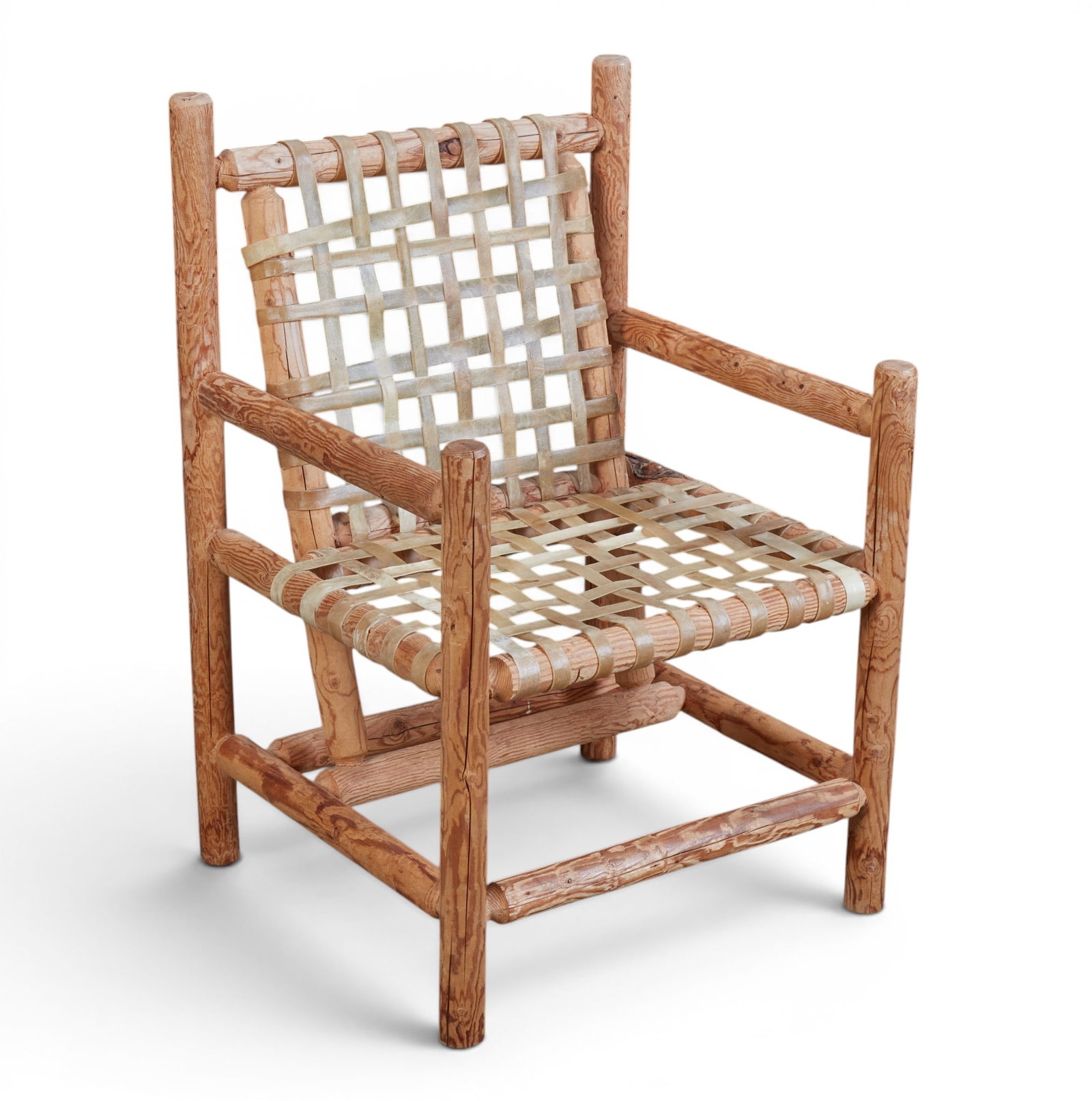 A rustic armchair: A rustic armchair height 36 x width 25 x depth 22 in. (91.4 x 63.5 x 55.9 cm.)