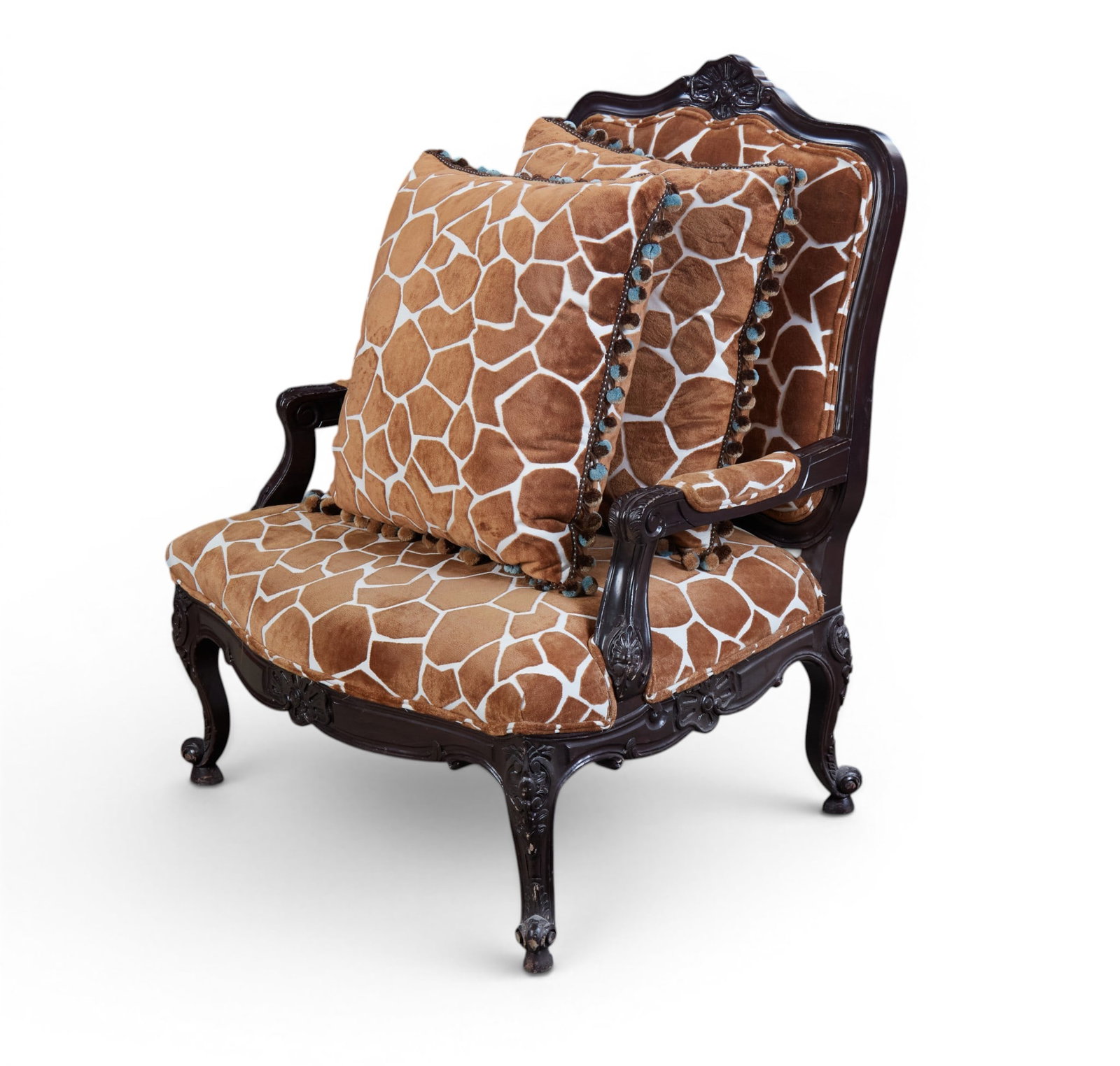 An armchair with two associated pillows: An armchair with two associated pillows height 42 x width 34 x depth 30 in. (106.7 x 86.4 x 76.2 cm.)